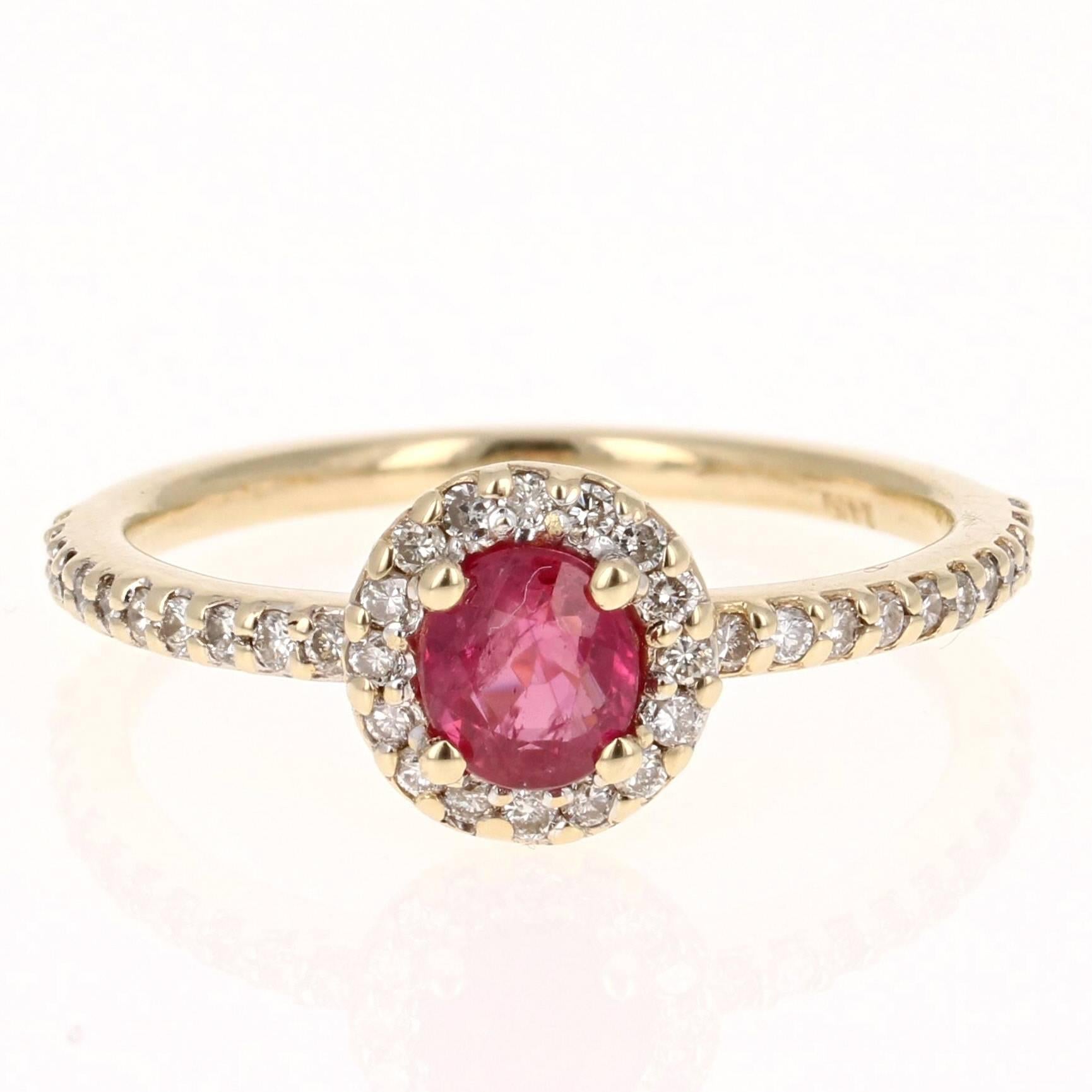 This elegant and dainty Ruby Diamond Ring can be a modern Engagement/Promise ring. It has a natural Burmese Ruby that is 0.67 Carats with a flow of 38 Round Cut Diamonds weighing 0.31 Carats. The total carat weight of the ring is 0.98 carats. 
It is