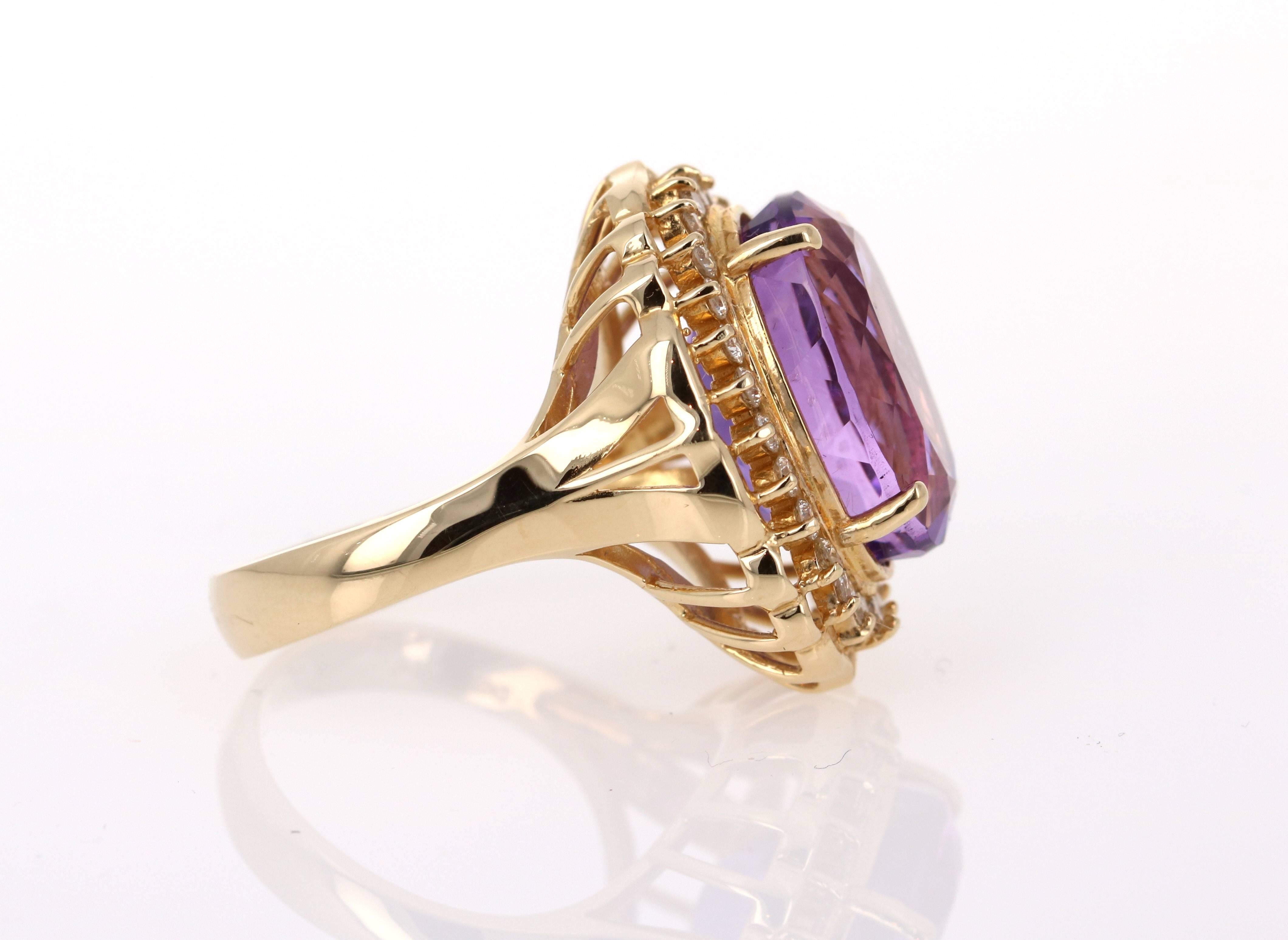 This gorgeous cocktail  ring has a huge Oval Cut Amethyst set in the center of the ring that weighs 11.79 carats. And it is surrounded by 26 Round Cut Diamonds that weigh 0.62 carats.  The clarity and color of the diamonds is: VS2 and H.  The total