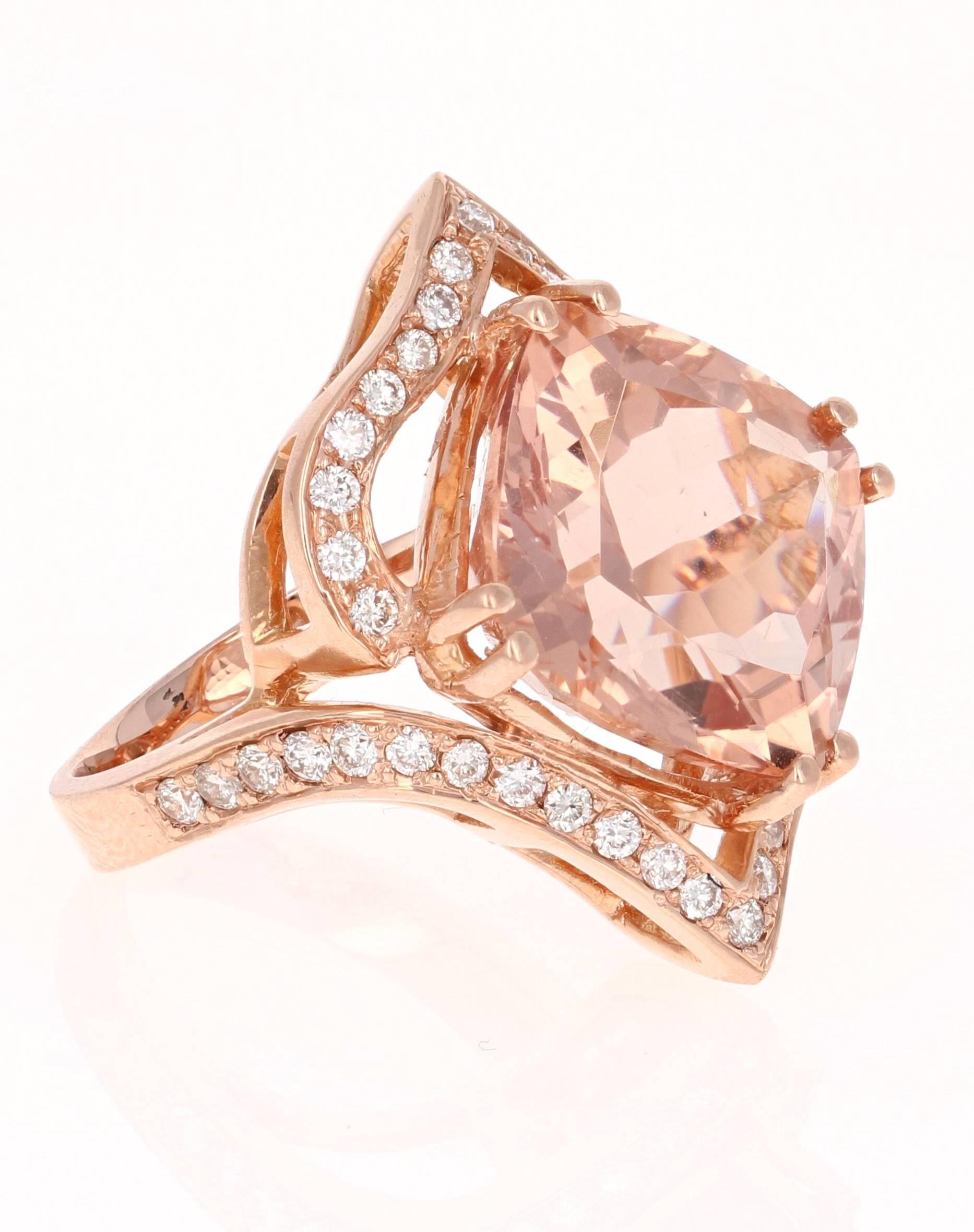 A gorgeous cocktail ring that is sure to stir up some real conversation at the next party! This ring has a huge 13.43 carat Morganite in the center of the ring and is surrounded by 42 Round Cut Diamonds that weigh 0.81 carat (Clarity: VS2, Color: H)