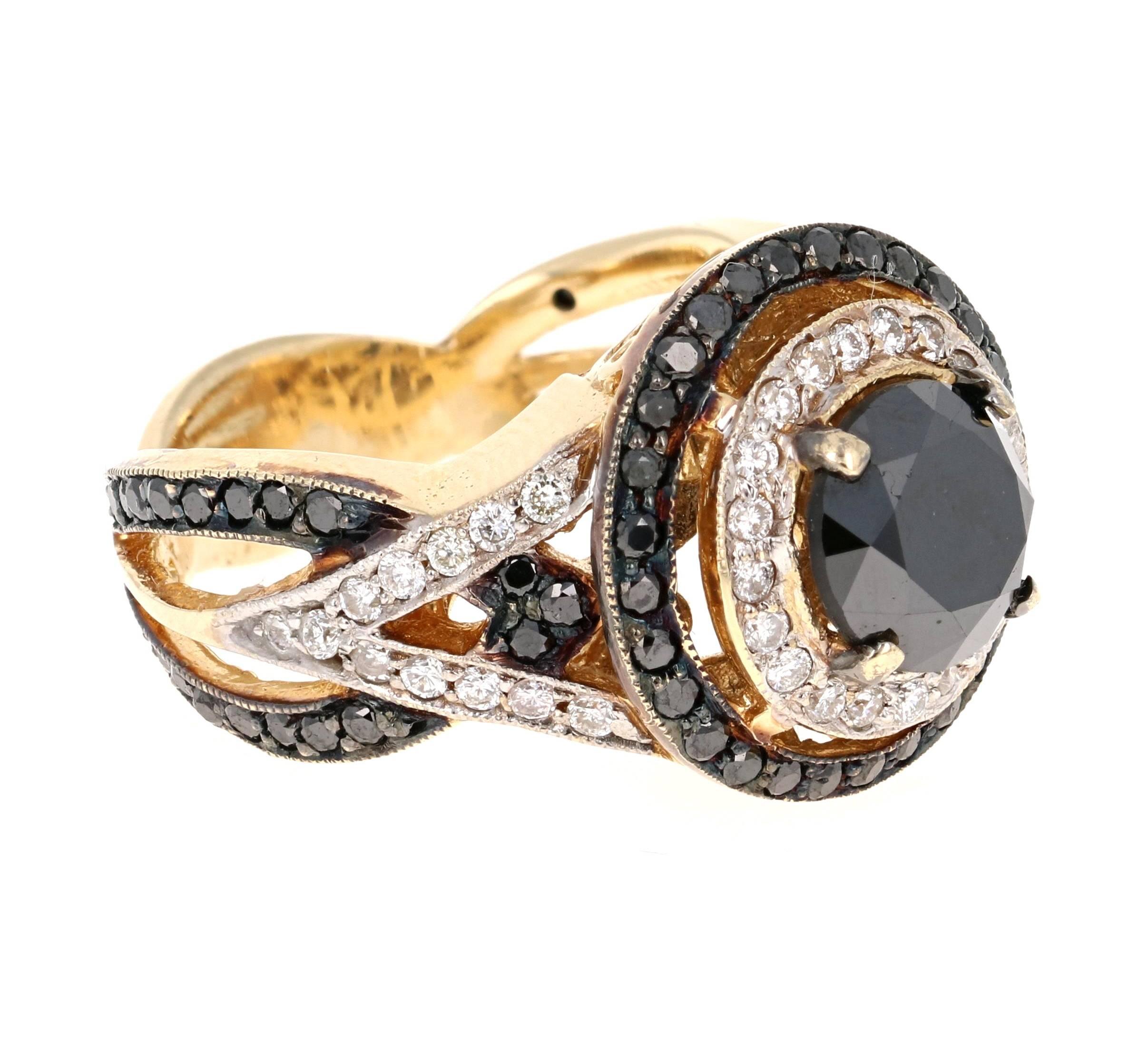 Gorgeous Black Diamond ring that can transform into an Engagement ring.  There is a 2.68 carat Round Cut Black Diamond in the center on the ring which is surrounded by 44 White Round Cut Diamonds that weigh 0.55 carat and 72 Black Round Cut Diamonds