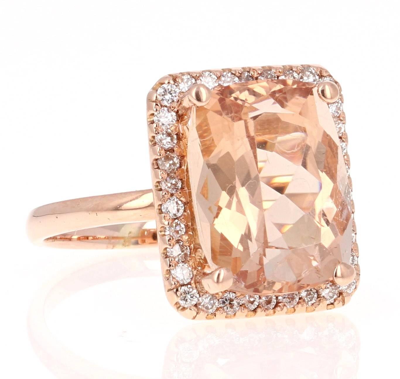 This classic Morganite Ring has a large Cushion Cut 7.44 Carat Morganite as its center and is surrounded by a halo of 34 Round Cut Diamonds that weigh 0.42 Carats. The clarity and color of the Diamonds are VS-F.   The total Carat Weight of the ring