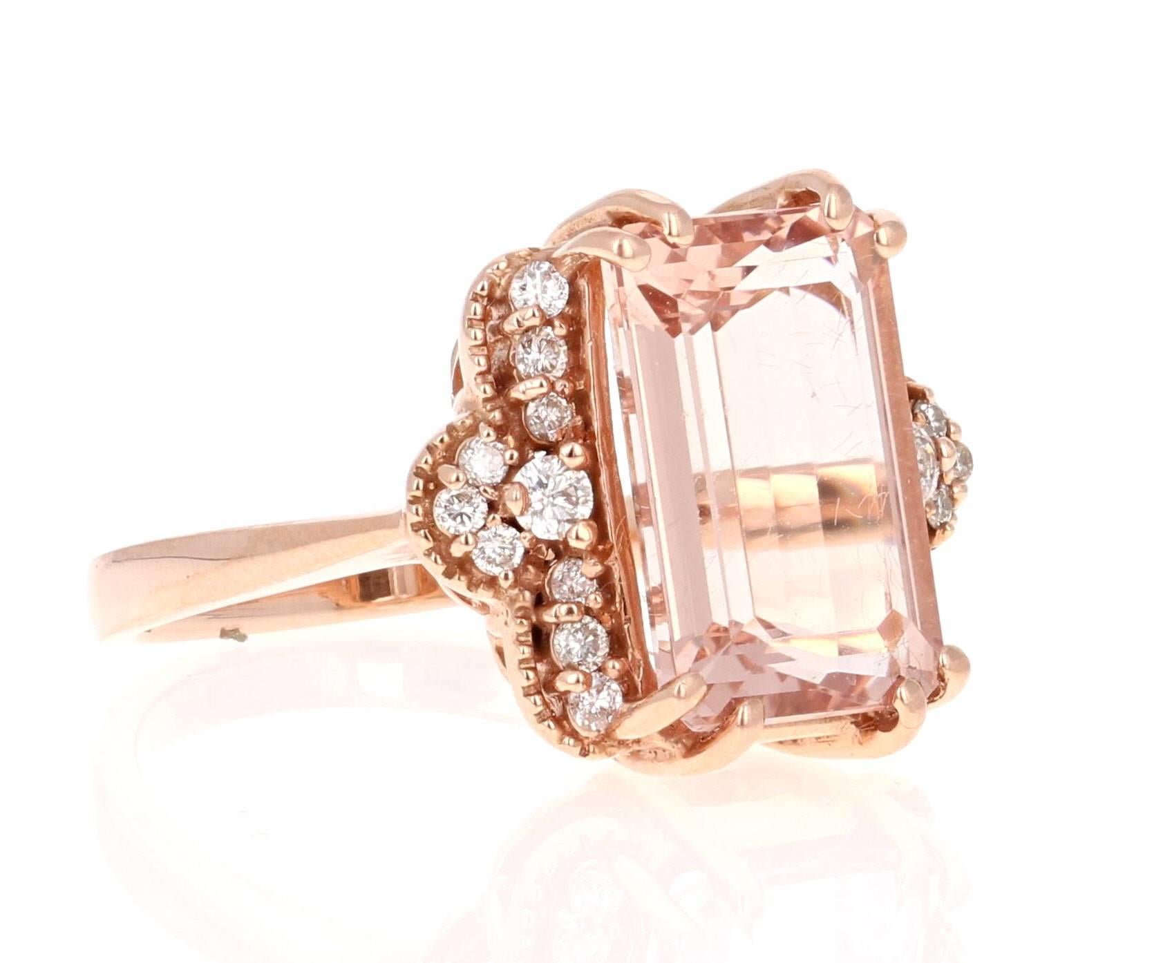 This beautiful Morganite Ring has a large Emerald Cut, 5.25 Carat Morganite as its center and is articulately surrounded by 20 Round Cut Diamonds that weigh 0.31 Carats. 
The style of the setting has an antique look to it. It is 14K Rose Gold and is