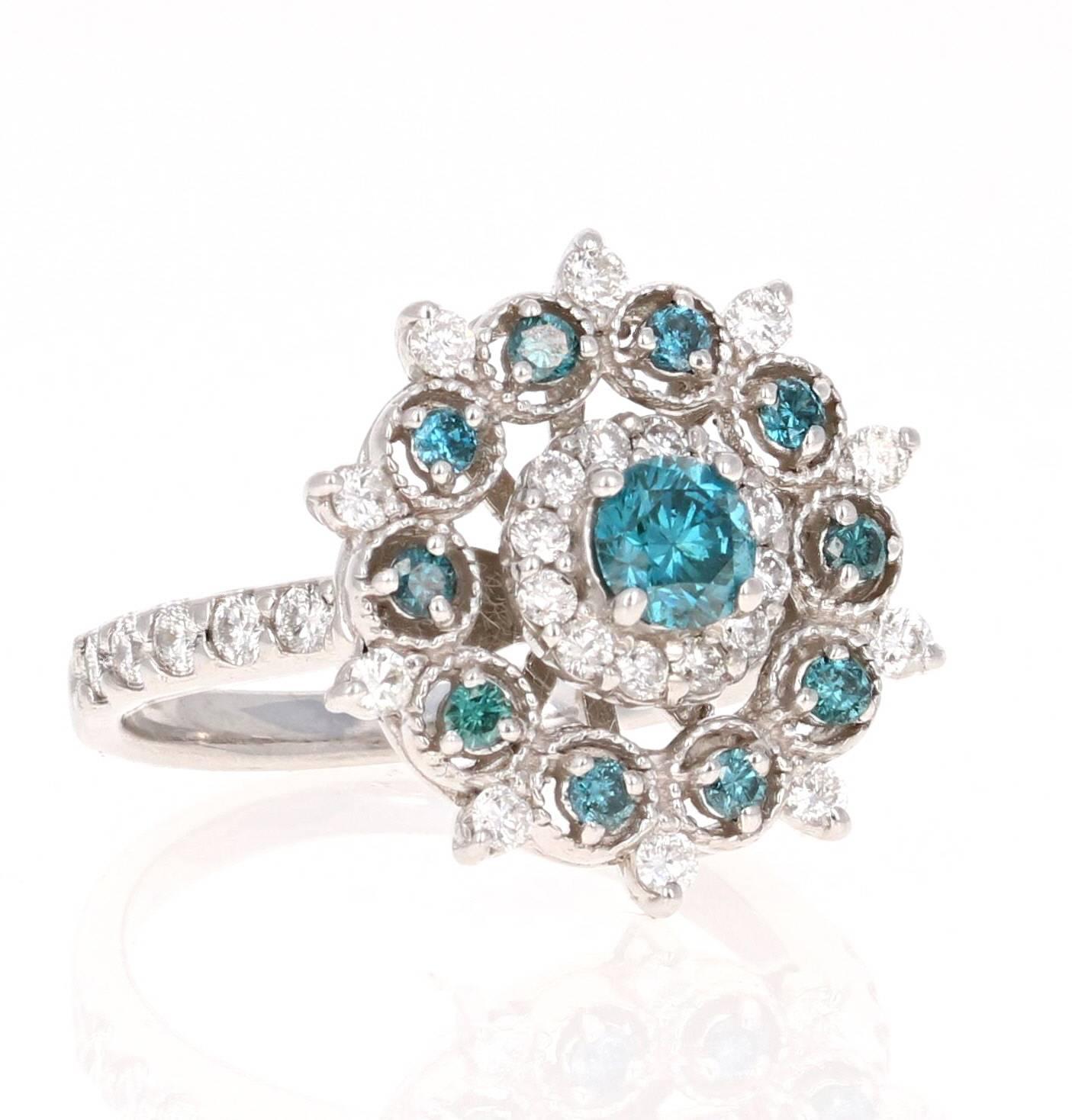 A gorgeous and intricate designed ring!  This pretty blue diamond cocktail ring can be a great addition to your jewelry collection.  The ring has 11 Blue Round Cut Diamonds that weigh 0.64 carats and 32 White Round Cut Diamonds that weigh 0.70