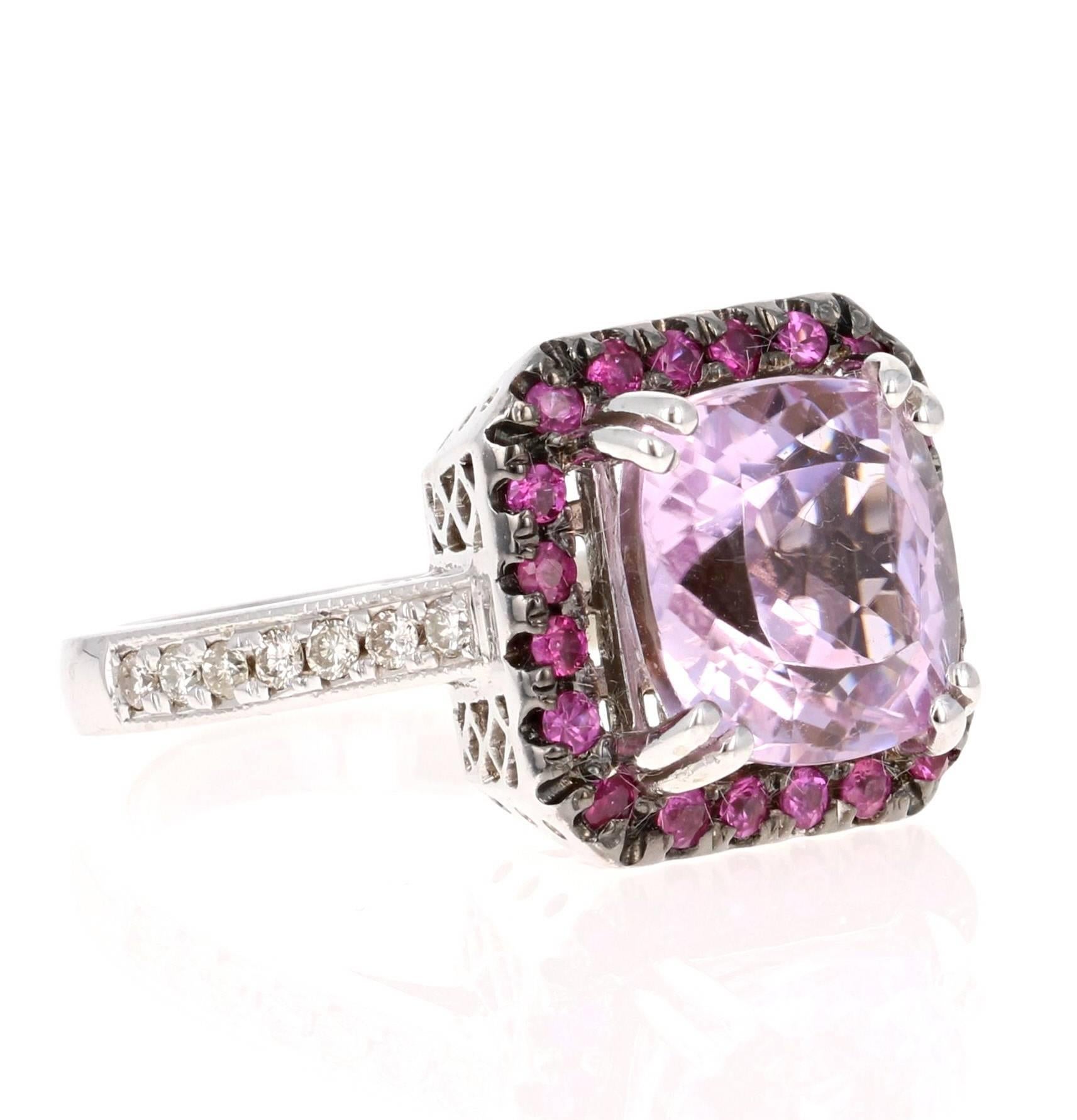 This beautiful ring has a lovely 5.31 carat Kunzite that is set in the center of the ring, it is surrounded by a unique halo of 20 Round Cut Pink Sapphires that weigh 0.37 carats.  This ring also has 15 Round Cut Diamonds that weigh 0.21 carat and