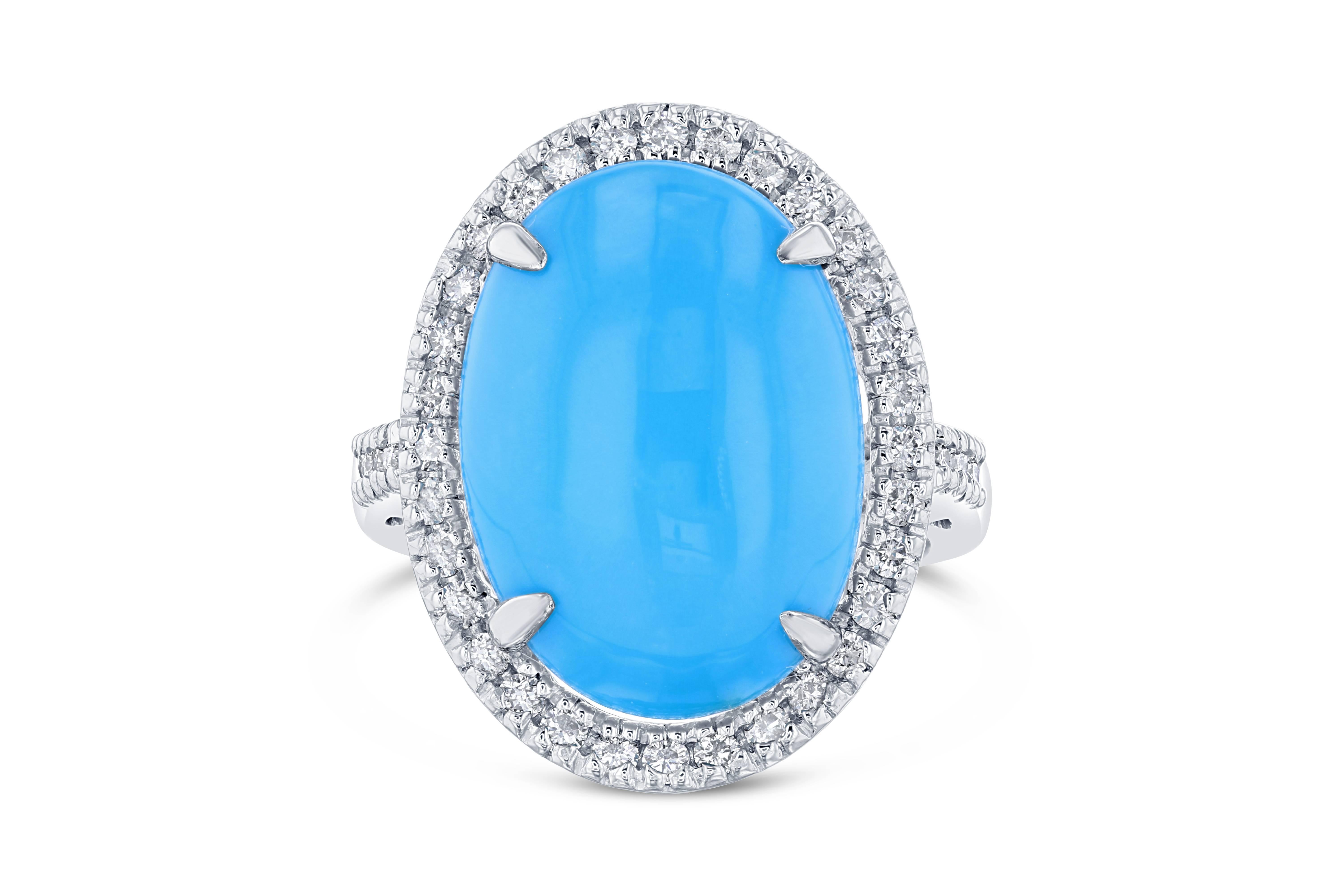 Beautiful Turquoise Diamond Cabochon Cocktail Ring!
The Oval Cut Cabochon Turquoise is 8.79 Carats and has a halo of 38 Round Cut Diamonds weighing 0.56 Carats. The total carat weight of the ring is 9.35 Carats. It is crafted in 14K White Gold and