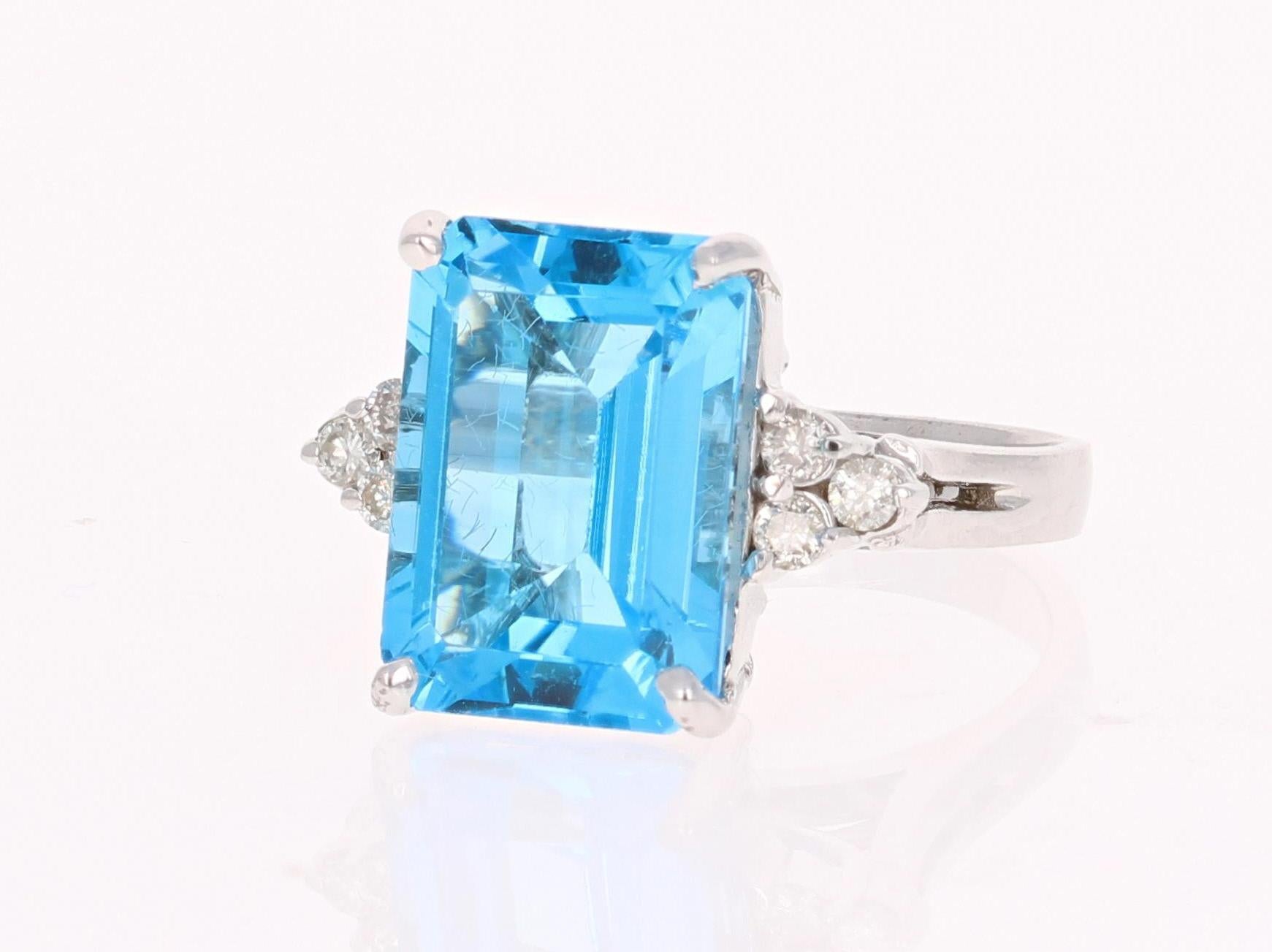 This beautiful Emerald cut Blue Topaz and Diamond ring has a stunningly large Blue Topaz that weighs 8.77 Carats. It is surrounded by 6 Round Cut Diamonds that weigh 0.23 Carats. The total carat weight of the ring is 9.00 Carats. 
The setting is