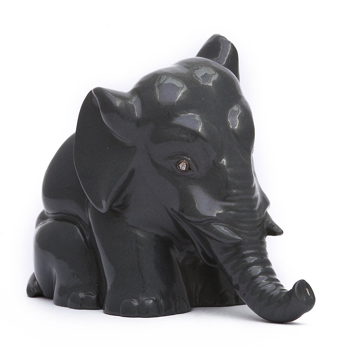 Kalgan jasper circus elephant sculpture with rose diamond-set eyes, head slightly turned. By Faberge. St. Petersburg, ca. 1900. L: 2 ½ in. 

Provenance: Estate of HRH The Prince Henry, Duke of Gloucester. Constance Gladys Robinson (1859-1917),