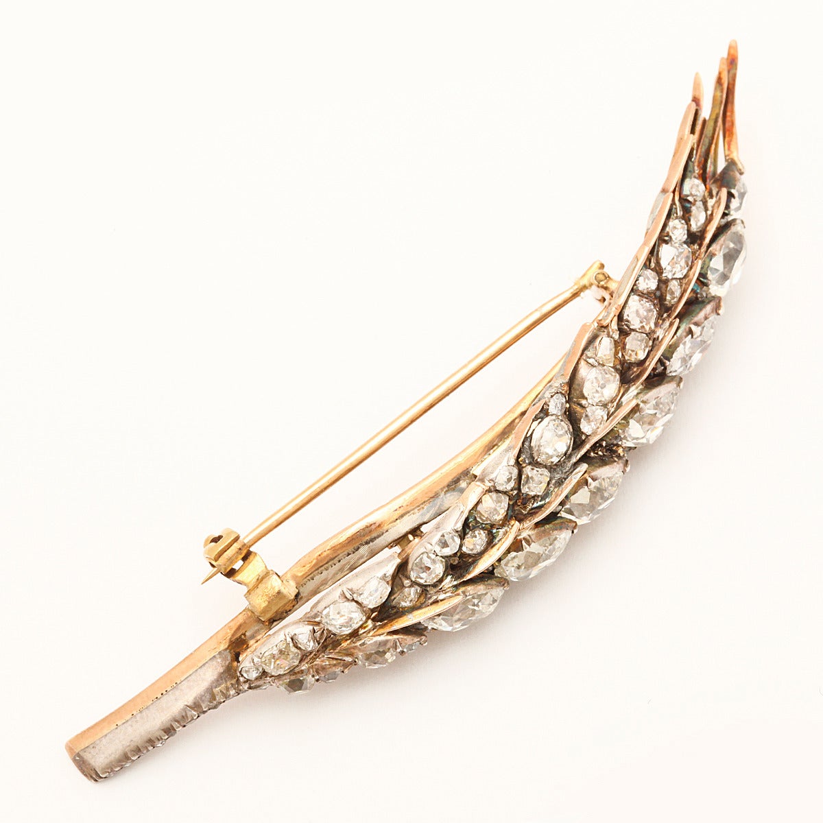 Old-mine pear-shaped diamond sheaf of wheat brooch set in silver and gold.

English, ca. 1890
Length: 3 inches
(approx. 6.75 cts)
