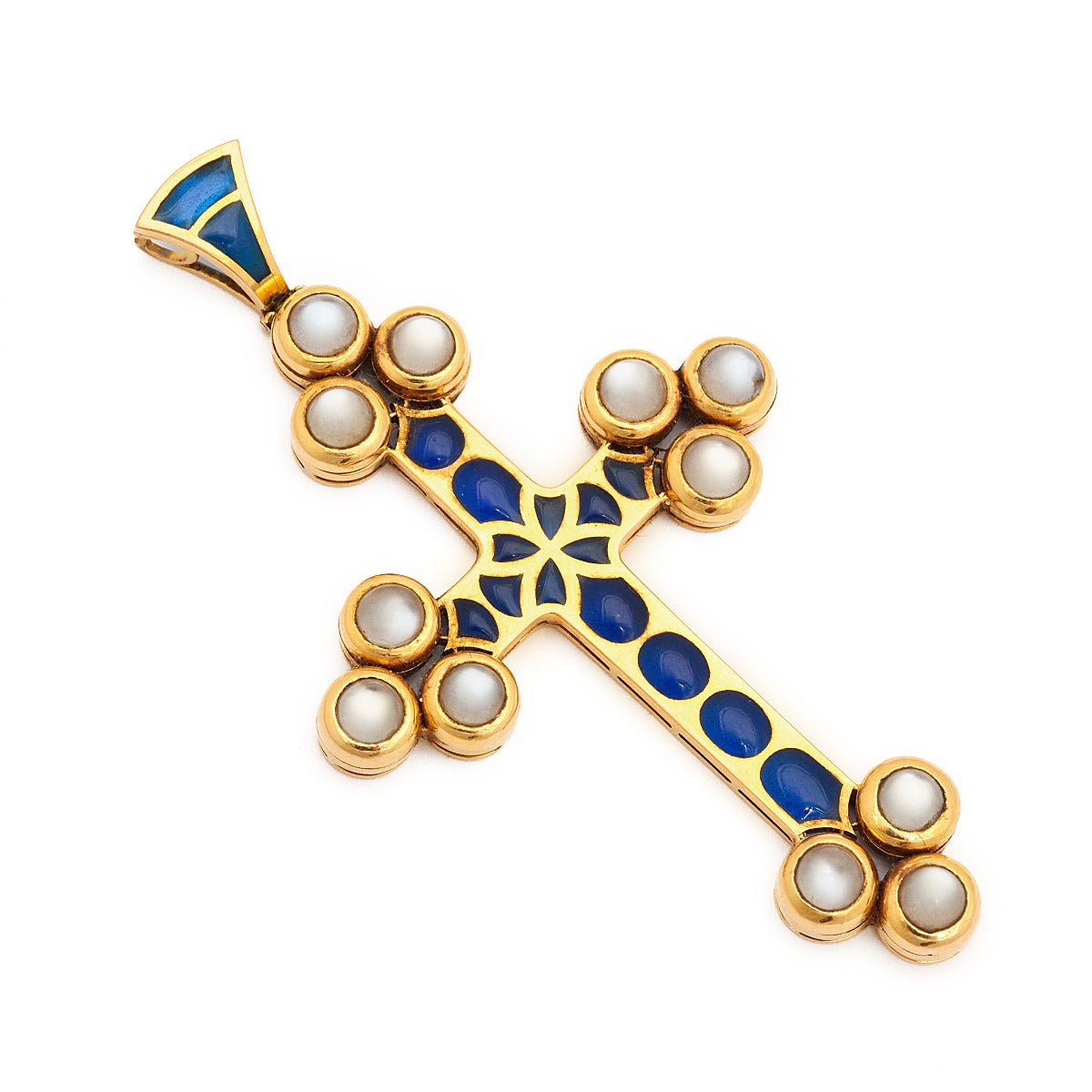 Renaissance revival gold pendant cross set with cabochon moonstones and blue plique-à-jour enamel.

English, ca. 1970
Length: 3 inches