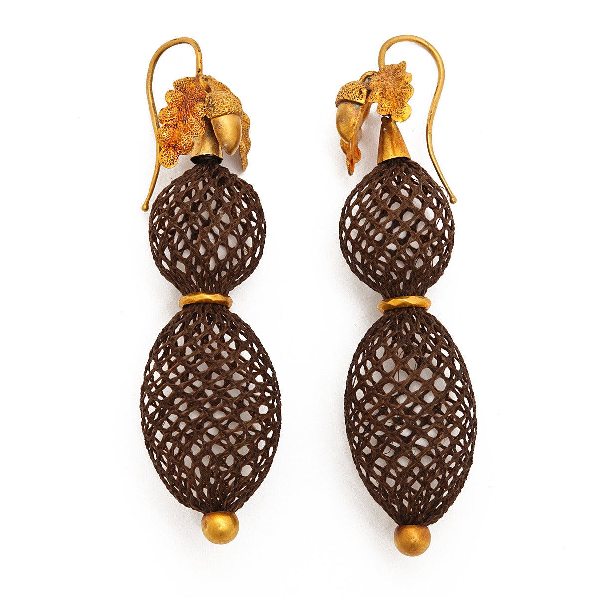 Pair of 18k gold and woven hair pendant earrings. The gold tops are in an acorn design, symbolizing the circle of life. 

English, ca. 1870