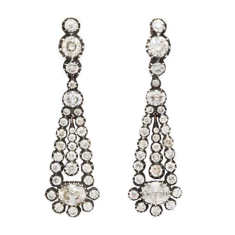 Pair of Victorian old-mine diamond drop earrings in a crimped blackened silver and gold setting.