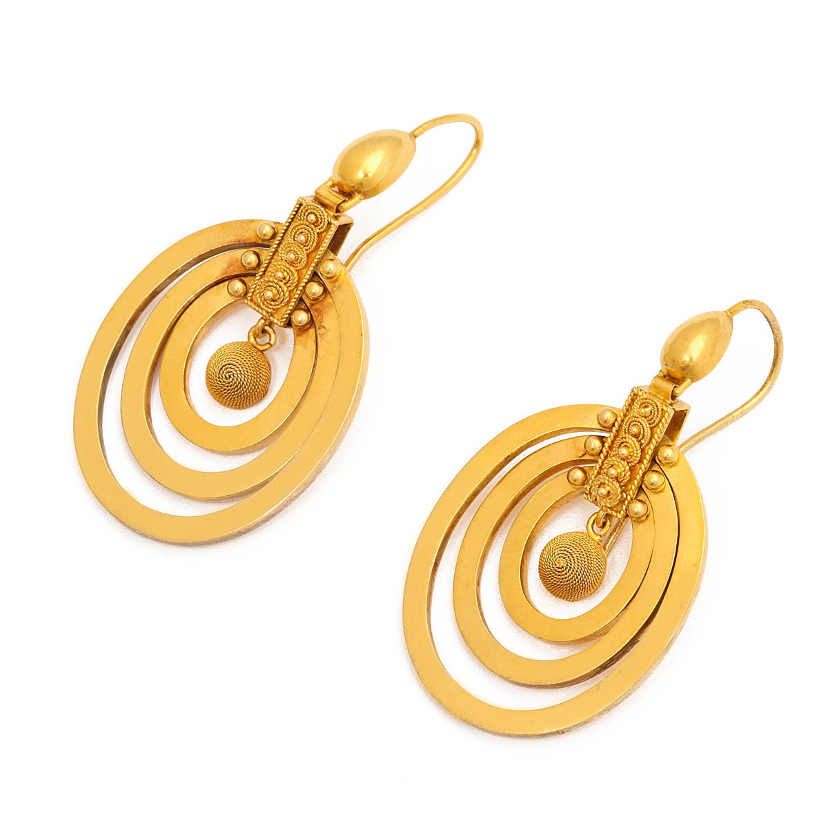 Victorian Roman Revival gold earrings composed of articulated triple hoops, with granulation. 

English, ca. 1885
Length: 2 inches