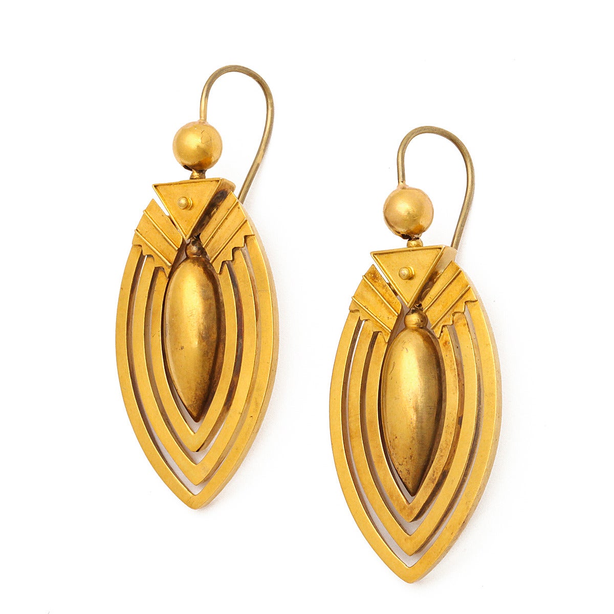Victorian Roman Revival gold earrings composed of three concentric rings around a center tear drop.

English, ca. 1885
Length: 2 inches