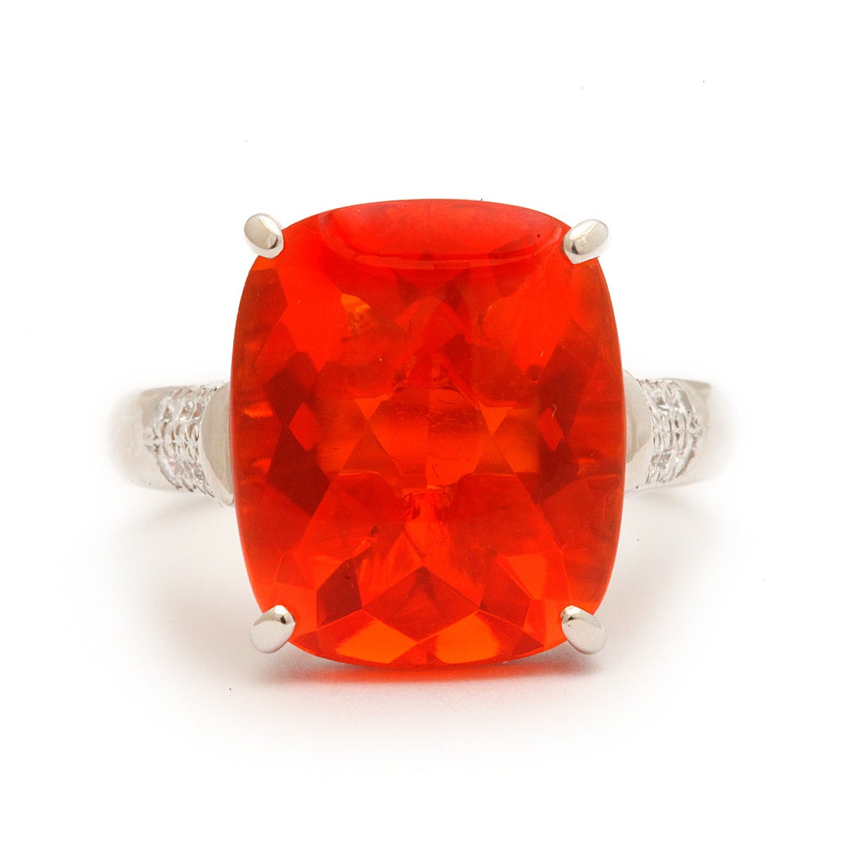 Mexican Fire Opal ring set in platinum with diamond-set shoulders.