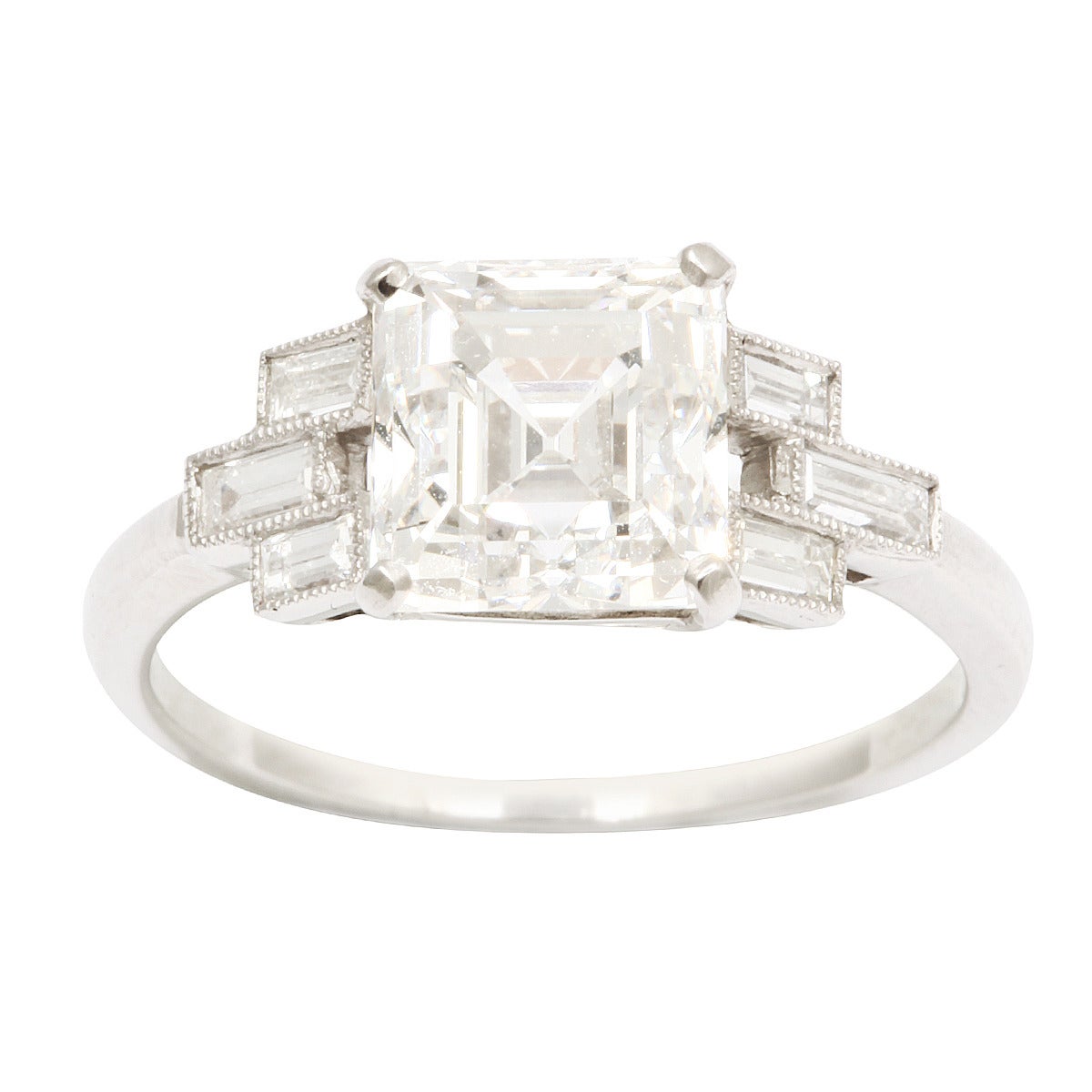 Asscher-cut diamond engagement ring set in platinum, with baguette and milgrain diamond shoulders.

American, ca. 1925
(2.40 cts G VS1 GIA Cert.)