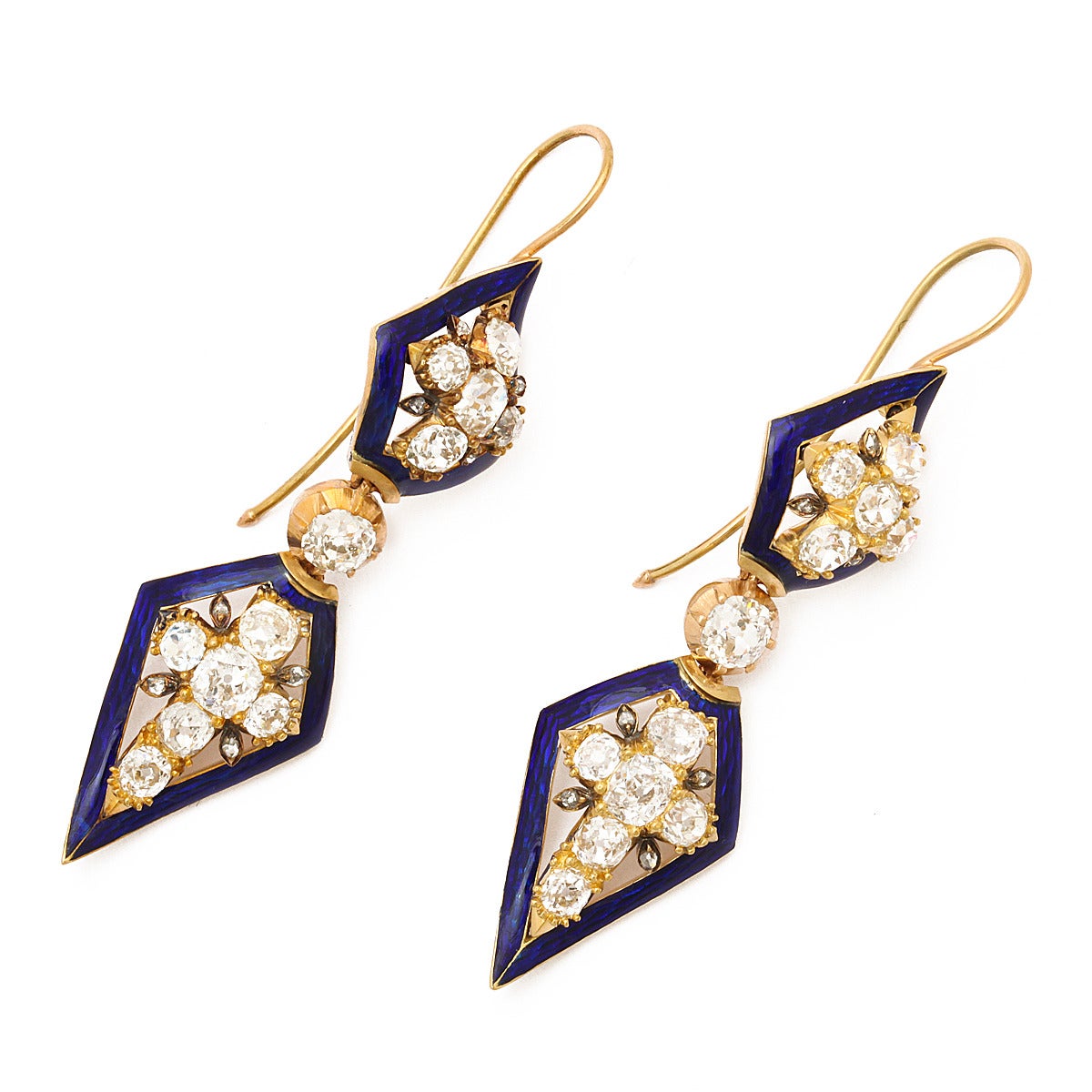Victorian lozenge-form pendant earrings with old-mine diamonds and dark blue enamel borders, set in gold.

English ca 1870.
Length: 2 1/2 inches
(approx. 10 cts total)