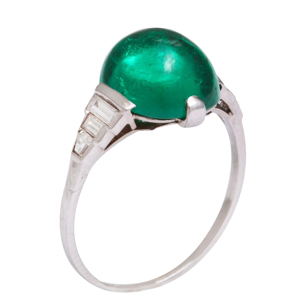 Cabochon emerald ring set in platinum and diamond mount.

English, ca. 1900
(Emerald approx. 4.3 cts)