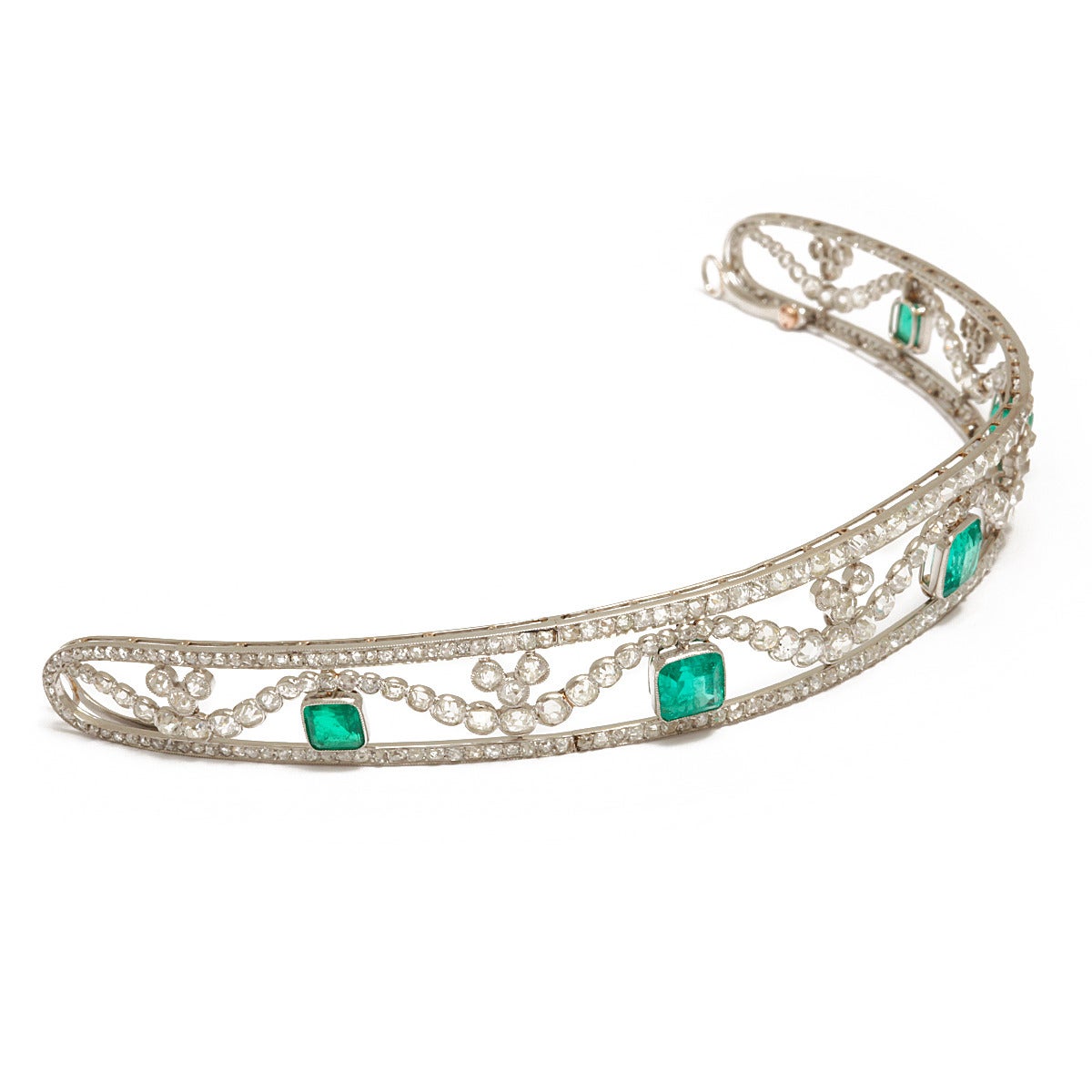 Edwardian emerald and diamond tiara/diadem delicately set in openwork platinum, made by famed jeweler Joseph Chaumet, who specialized in tiaras.

Paris, ca. 1910.
(Approx. 25 cts. of diamonds; 16 cts. of emeralds)