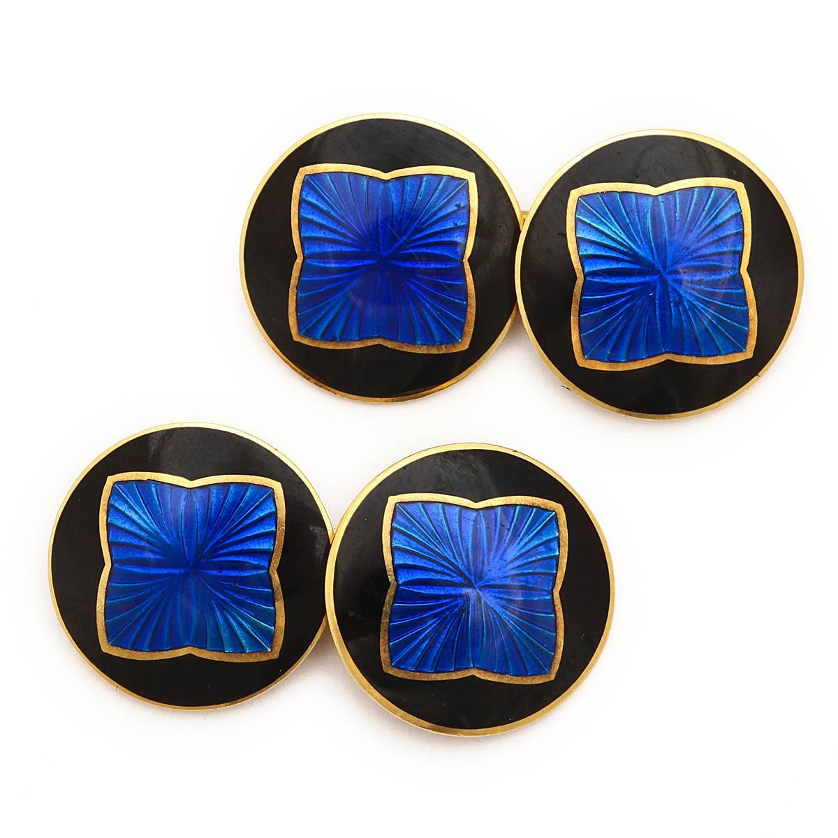 14k gold double cufflinks with an opaque black enamel ground centered by a blue guilloché enamel quatrefoil.

By Riker Bros., Newark ca. 1900

Newark, NJ became the center of American jewelry production early in the nineteenth century. New