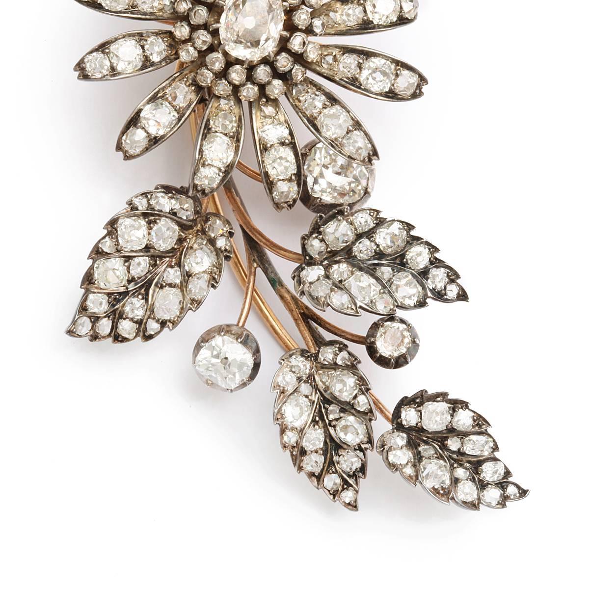 Victorian en tremblant old-mine diamond floral spray brooch set in silver and gold. In A La Vieille Russie Paris box.

French, ca. 1870
Length: 4 1/2 inches
(approx. 16 cts total)