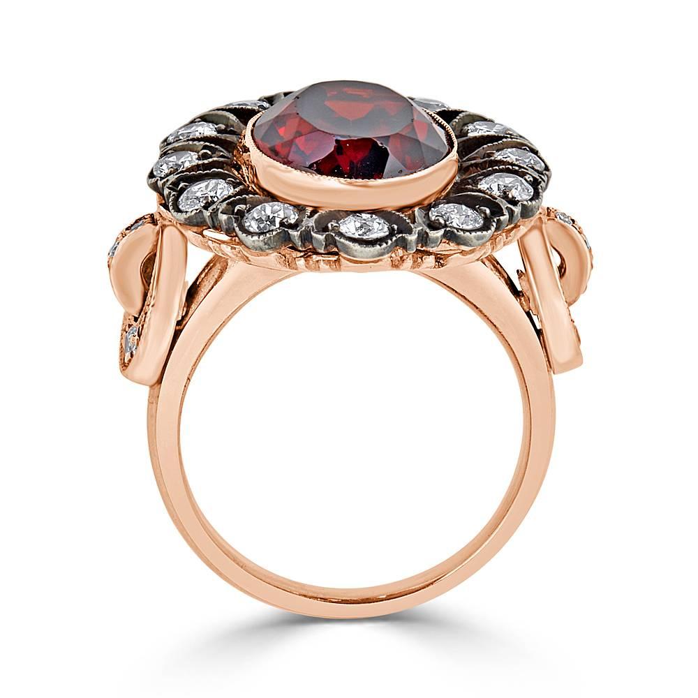 A beautiful Natural Garnet and Old Miner Diamond Ring handcrafted in 18k Rose Gold and Sterling Silver. This ring features 0.92 carats Total of Old Miner White Diamonds and a center set faceted 8.60 carat Red Garnet. This ring is finished with an