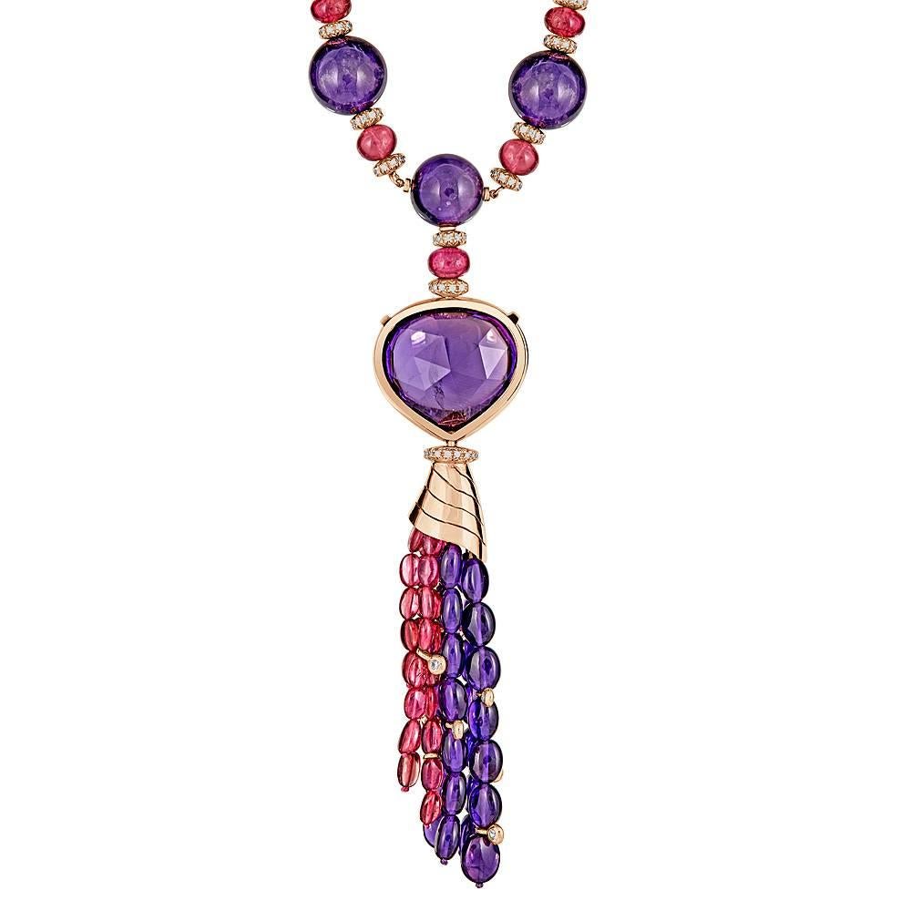 An impressive Amethyst and Pink Tourmaline Necklace in 18k Rose Gold accented with Pave White Diamonds and Pink Sapphires. This necklace is 18 inches Long and has a 5 inch Long hanging drop. There are 501 pave diamond totaling 3.70 carats and 22