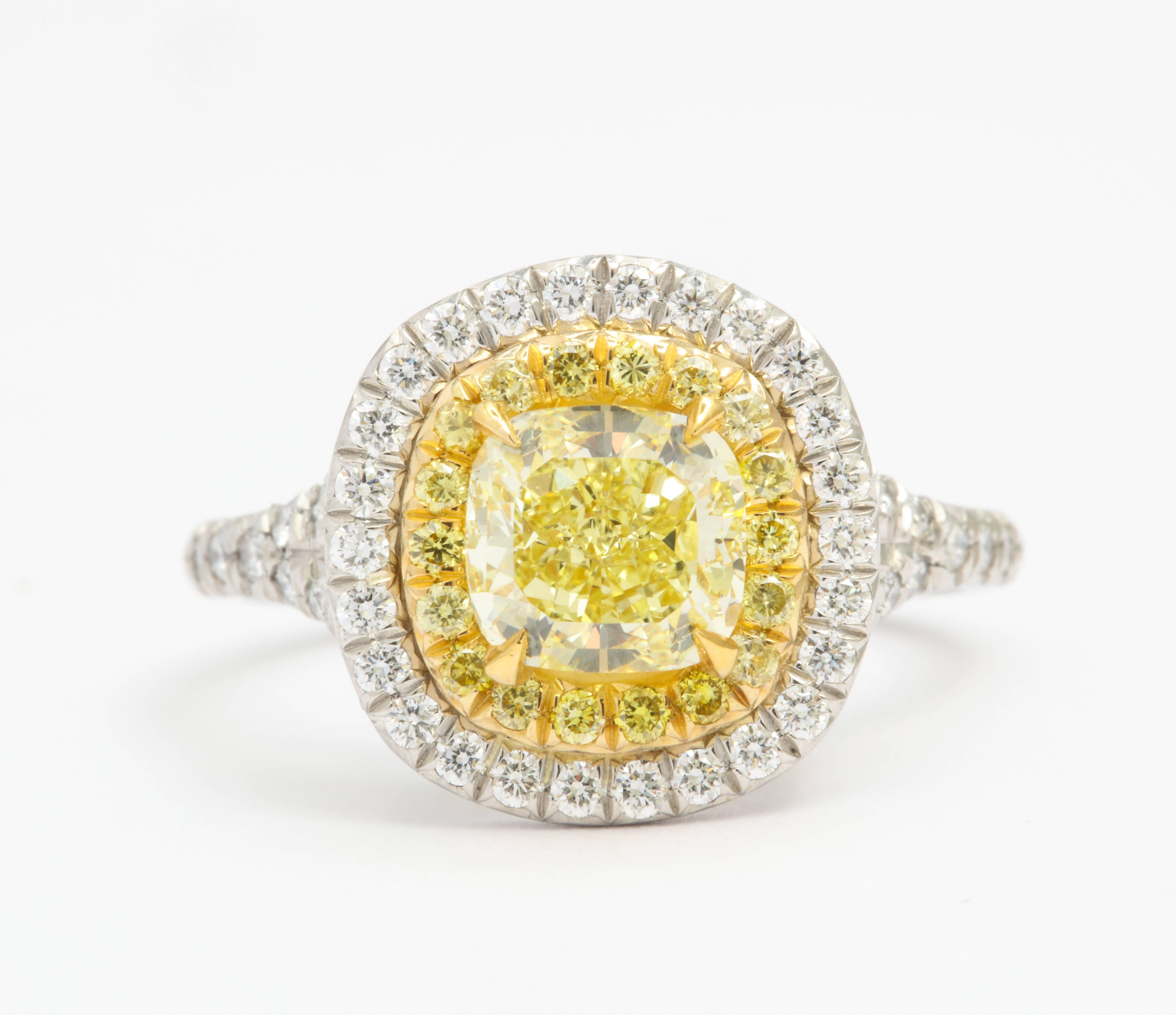 Contemporary GIA Certified Cushion Cut Intense Yellow Diamond Ring in Platinum 