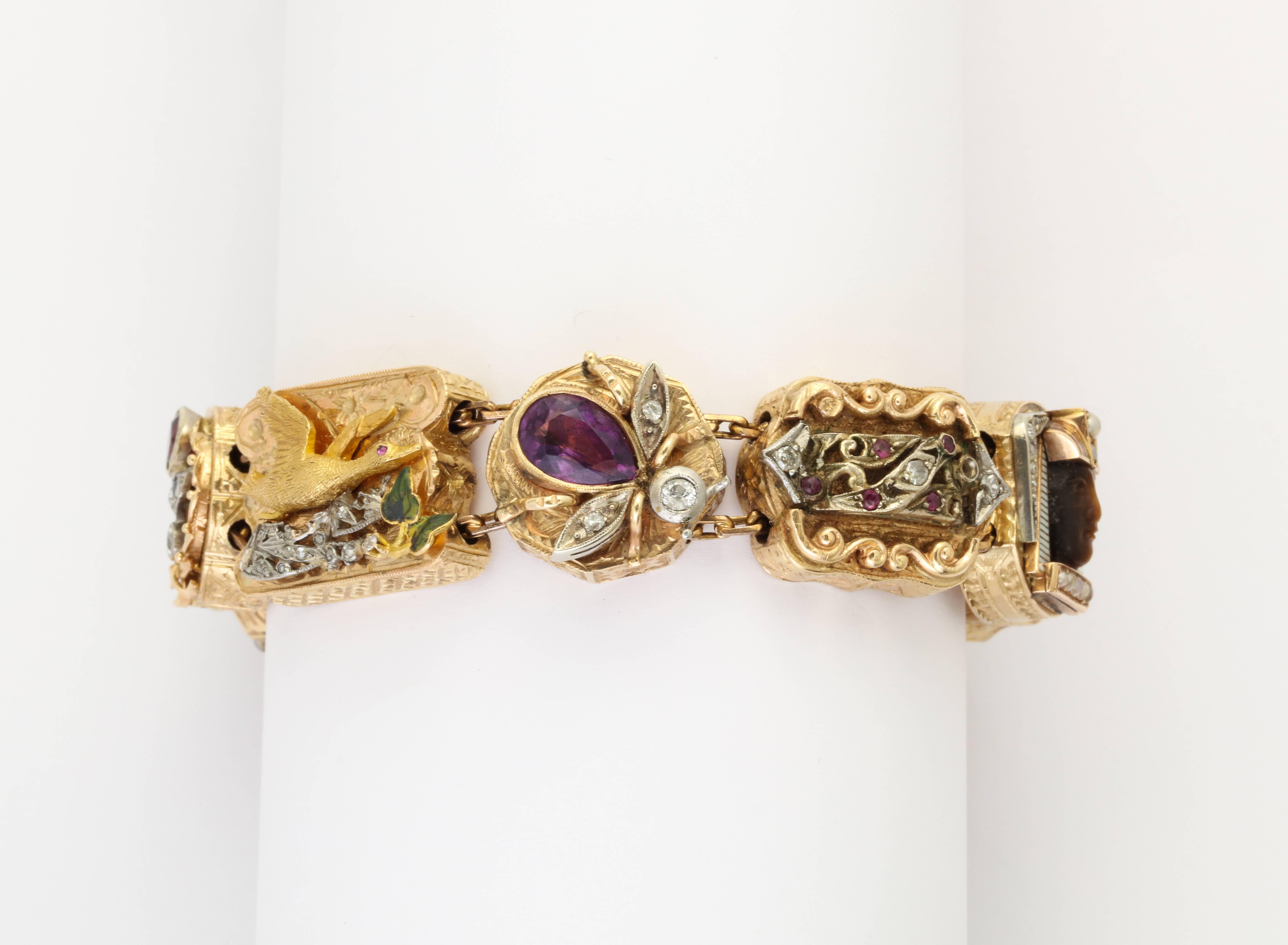 A slide charm bracelet featuring 9 rectangular victorian era watch slides, refashioned as a slide charm bracelet. This became a fashion trend in the 1930's, after the introduction of ladies wrist watches, when watch fobs and watch pendants were no