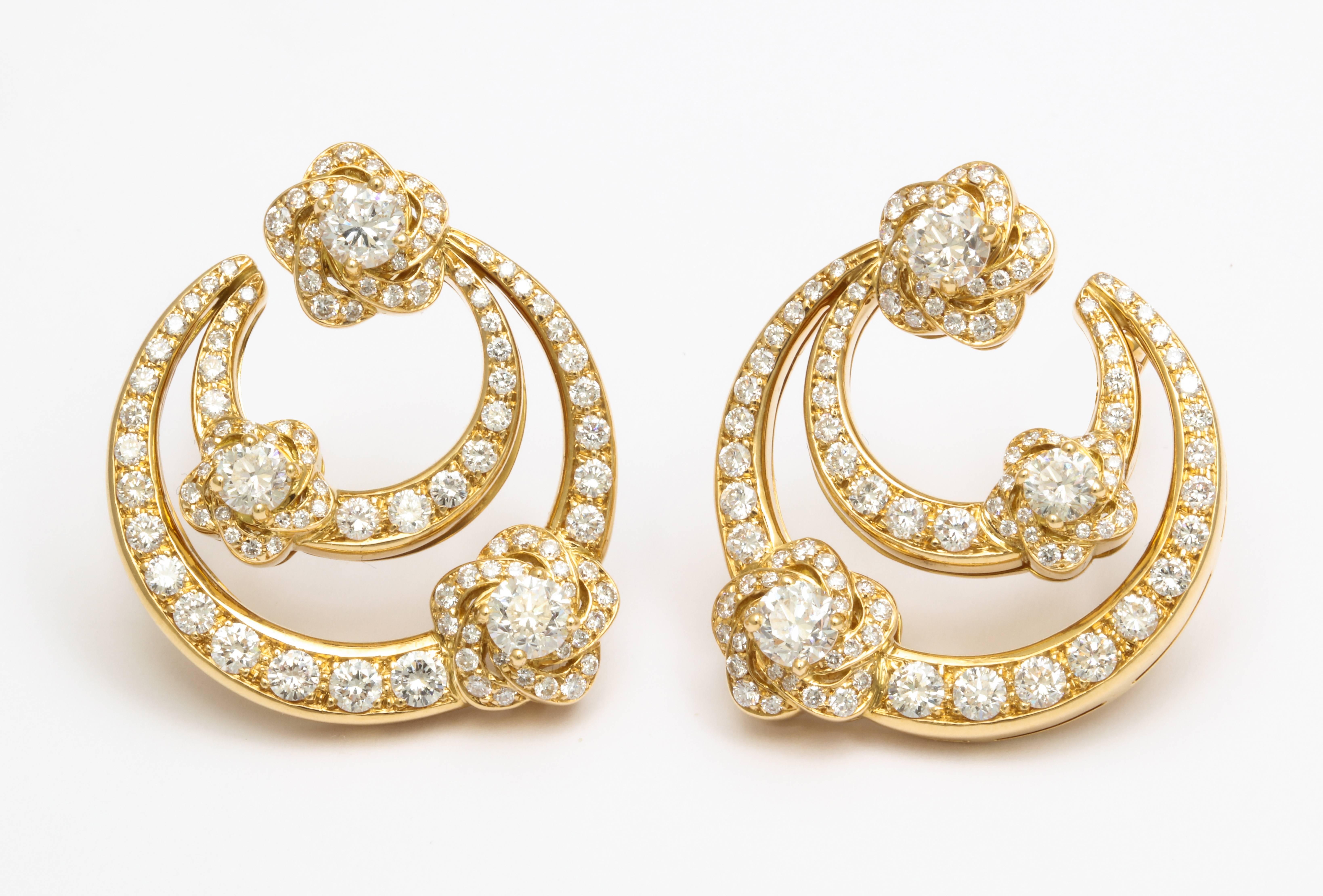 A pair of 18 karat yellow gold earrings, signed Bulgari with a total diamond weight of approximately 6 carats. Circa 1980's. Made in Italy. Instantly recognizable, and a great addition to every woman's collection.
