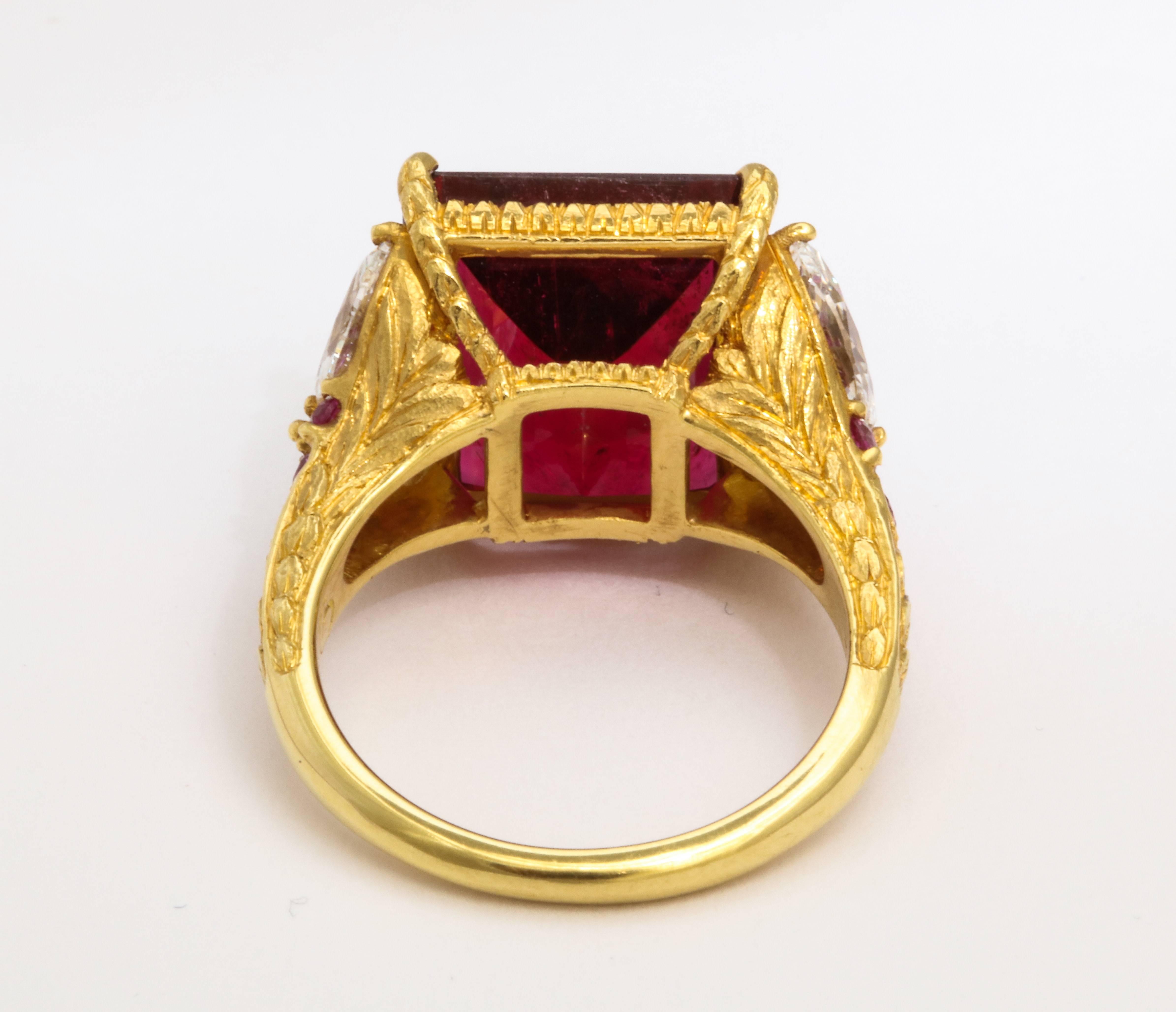 We can't believe this ring is still available! A remarkable value for this unique and sophisticated red stunner! A one of a kind cocktail ring featuring an exceptionally clean, rare emerald-cut rubellite of the purest red color, weighing 10.12