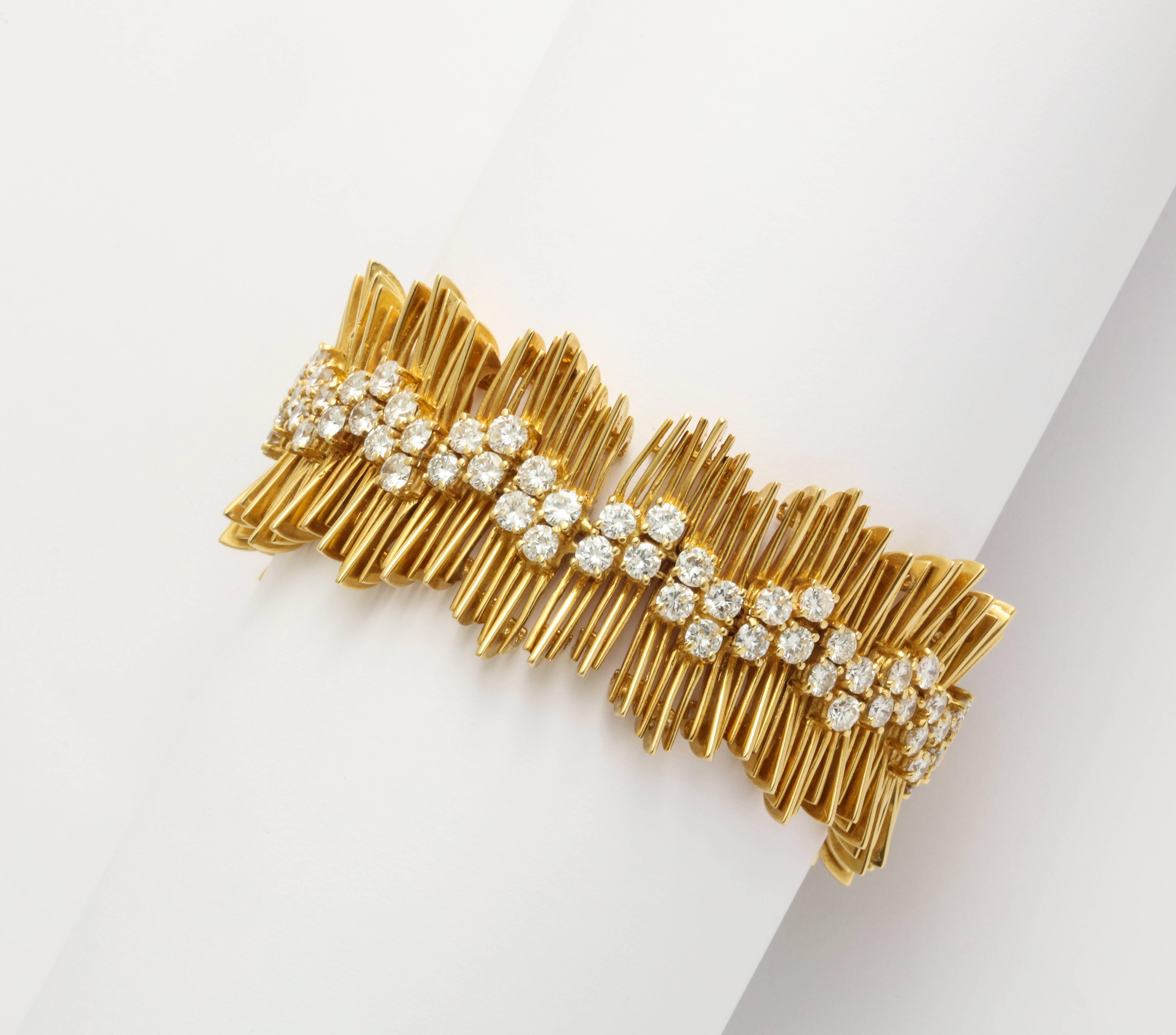 A bracelet set in 18 karat yellow gold featuring round brilliant cut diamonds with a total weight of approximately 10.20 carats. The diamonds are of high quality, ranging from F-H in color, VS clarity. 6.5 in. in length. 