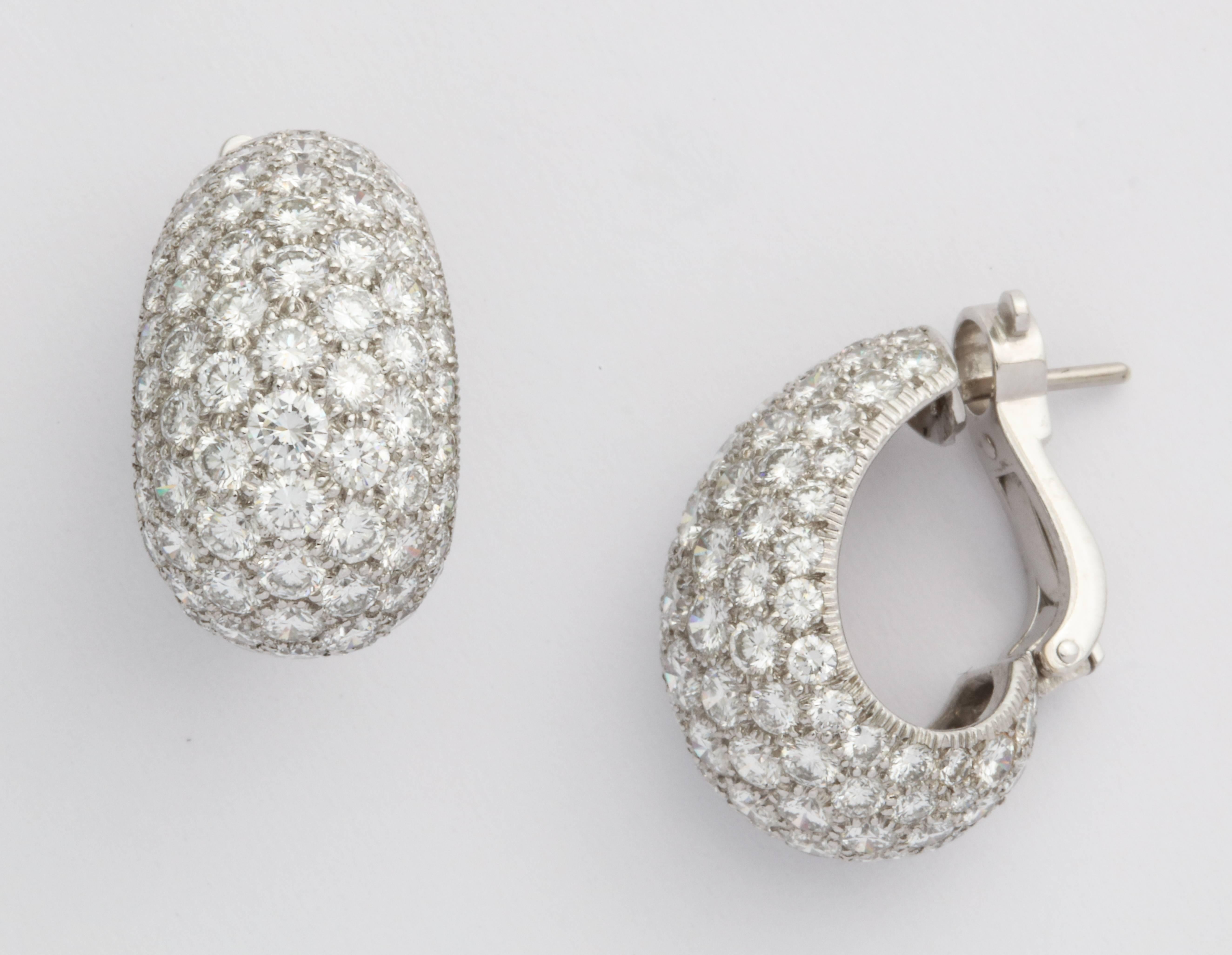 A pair of platinum and diamond hoop earrings, perfect for day or night. An estimated diamond weight of 8.50 carats. Beautifully set in Platinum. Signed Cartier 765048. French marks. Posts easily adjusted or removed for buyer upon request