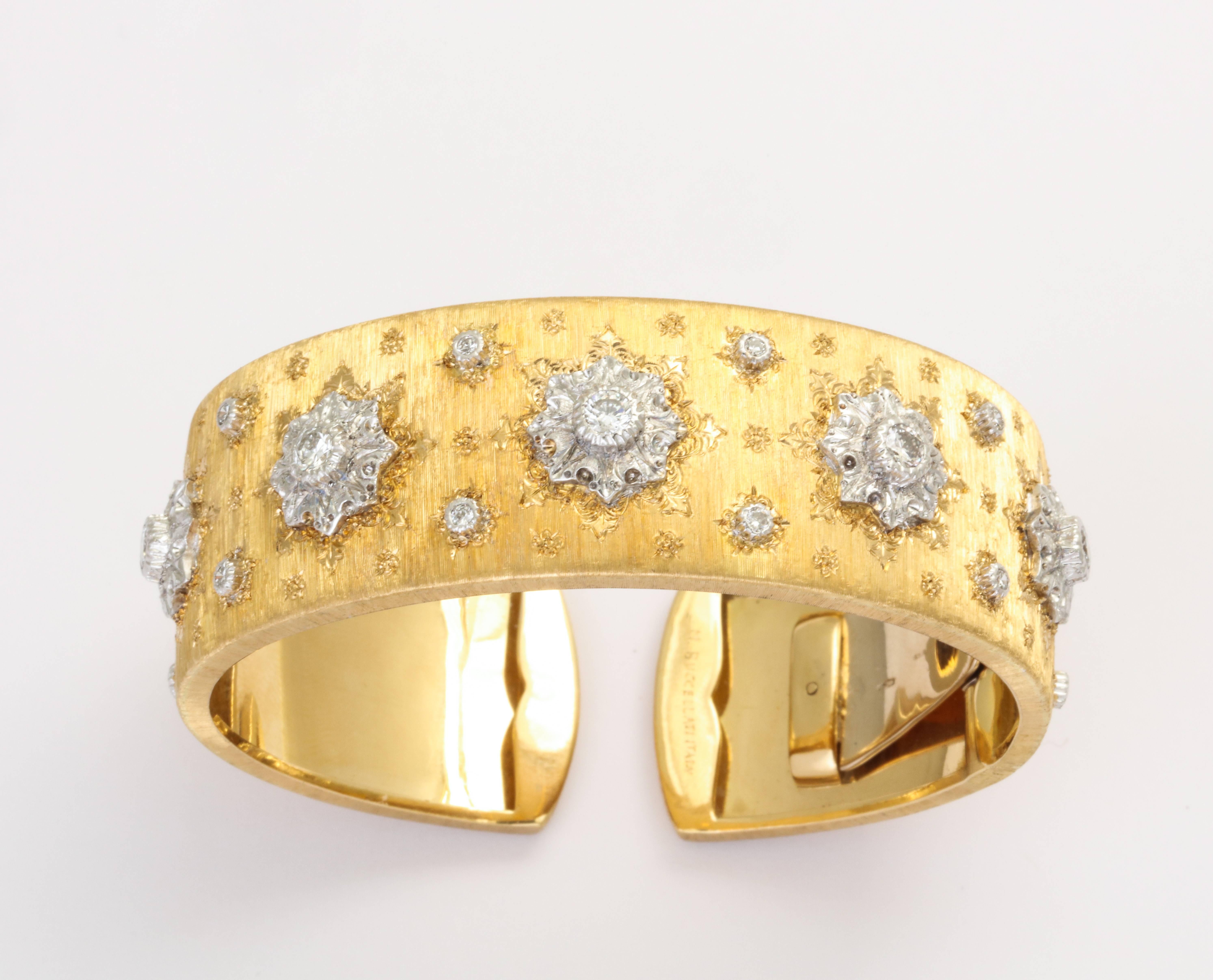 An 18 karat yellow gold hand engraved diamond cuff bracelet by Mario Buccellati. Made in Italy. The bracelet has an estimated total diamond weight of 1.05 carats. Circa 1980s. With a hinged arm, the interior measures 6 1/4 inches.  Super-stylish,