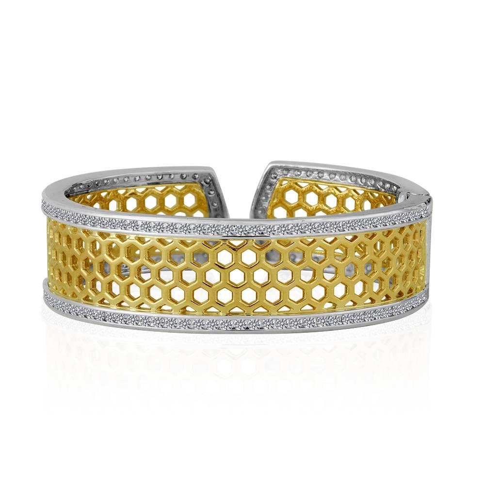 Exclusively from Design By Vatche, Honey Collection.
Beautifully hand crafted 14 karat and sterling silver with diamonds all around cuff bracelet. This cuff bracelet opens with a spring claps for a secure and easy wear.
Diamonds: 6.09 carat total