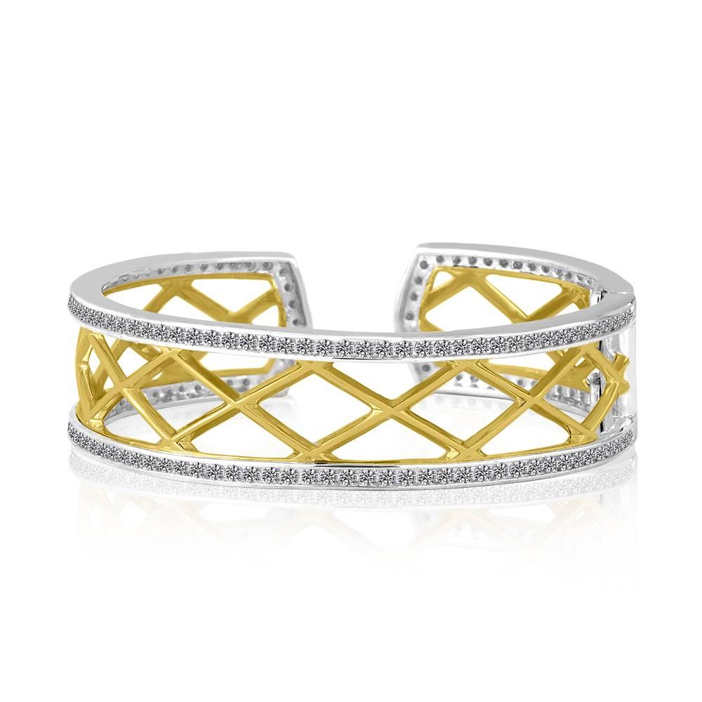 Exclusively from Design By Vatche, Honey Collection.
Beautifully hand crafted 14 karat gold and sterling silver with diamonds all around. This cuff bracelet opens with a spring claps for a secure and easy wear.
Diamonds: 6.09 carat total weight.