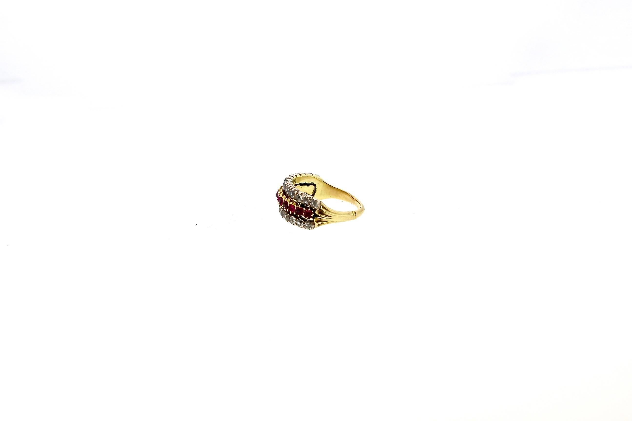 This handsome ruby and diamond ring has the illusion of a stacked band, but it is an antique half hoop ring.  Bright red rubies are set in gold and on either side of it as old mine cut diamonds set in silver topped gold.  The shank and the band are