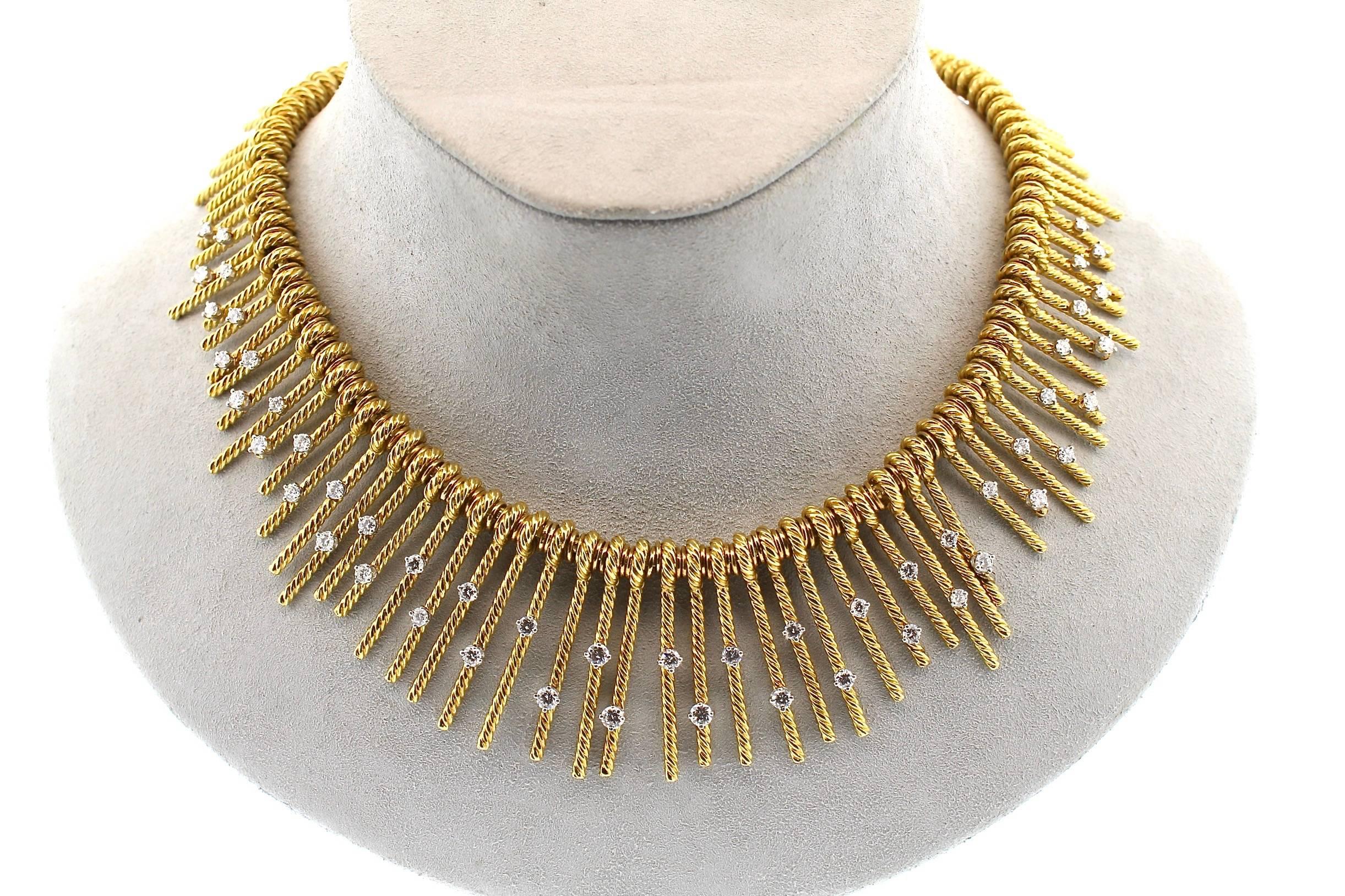 Mid-century modern magnificence!  This ultra chic gold and diamond necklace by Tiffany & Co. was designed by the masterful Jean Schlumberger.  It features the twisted gold work that he was known for, creating texture and angles that are modern