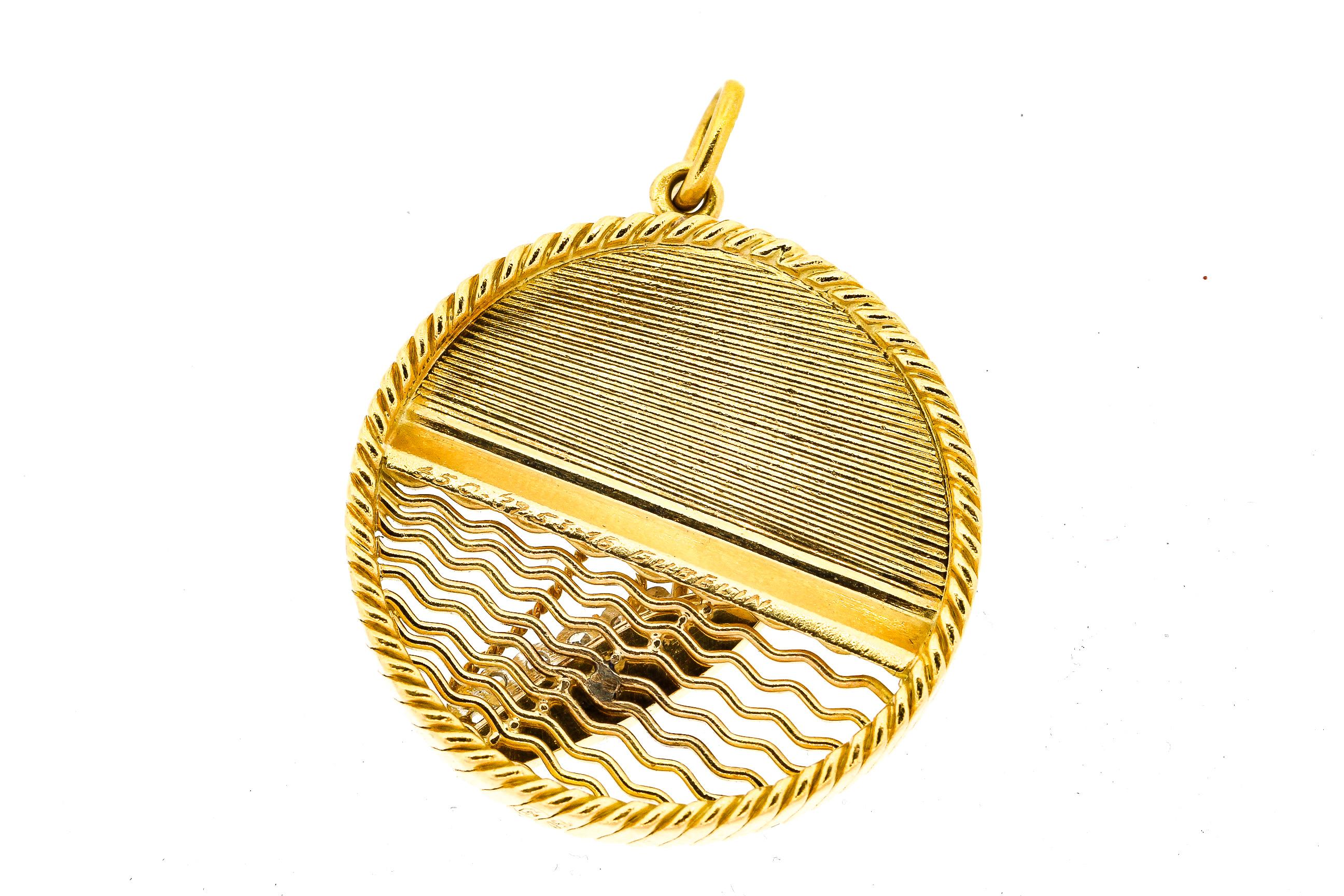A wonderfully made 18k yellow gold charm depicting a sailboat docked near palm trees signed Gubelin. The charm is fully marked with French hallmarks and was likely made by Georges L’Enfant who made these masterful gold charms, chains and bracelets