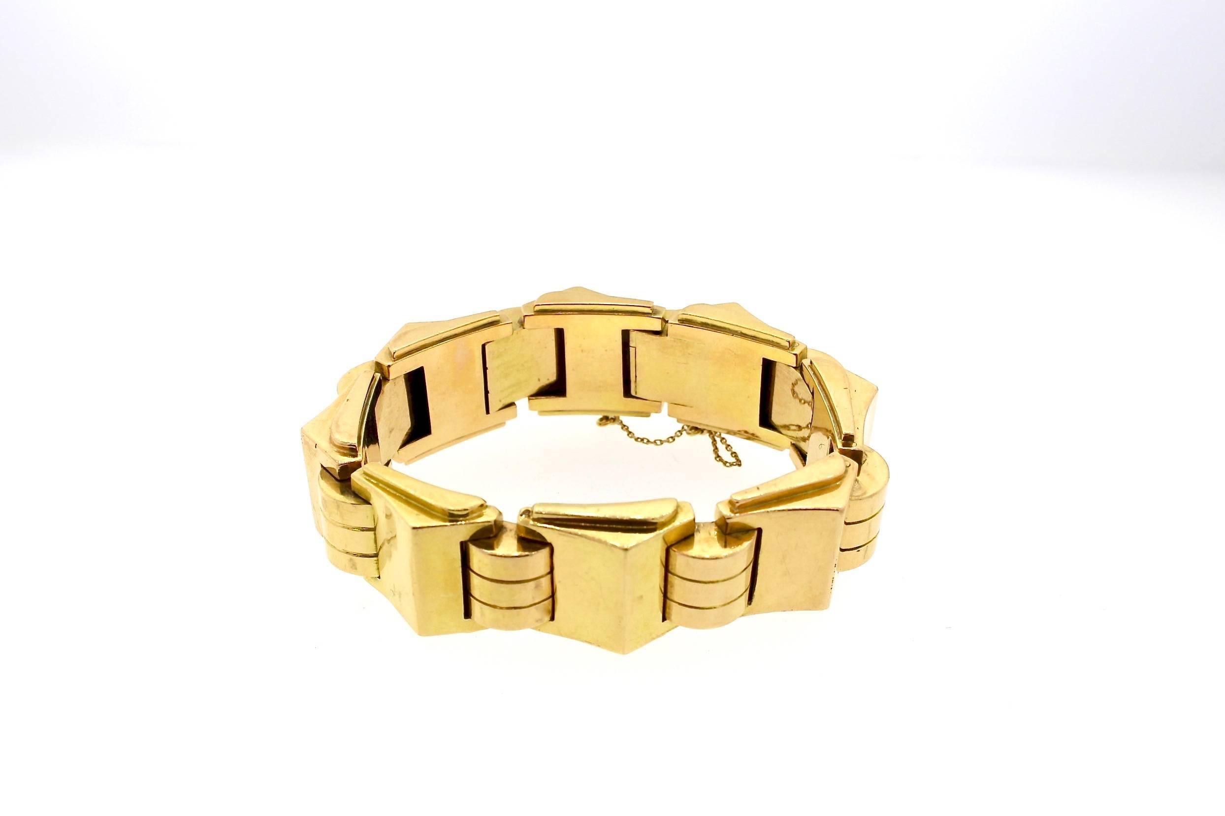 This bold Retro bracelet is an everyday easy to wear dream.  They became popular during World War II when the links of the bracelet were made to resemble the tread of a tank.  This heavy and bold 18k yellow gold link bracelet was made in France and
