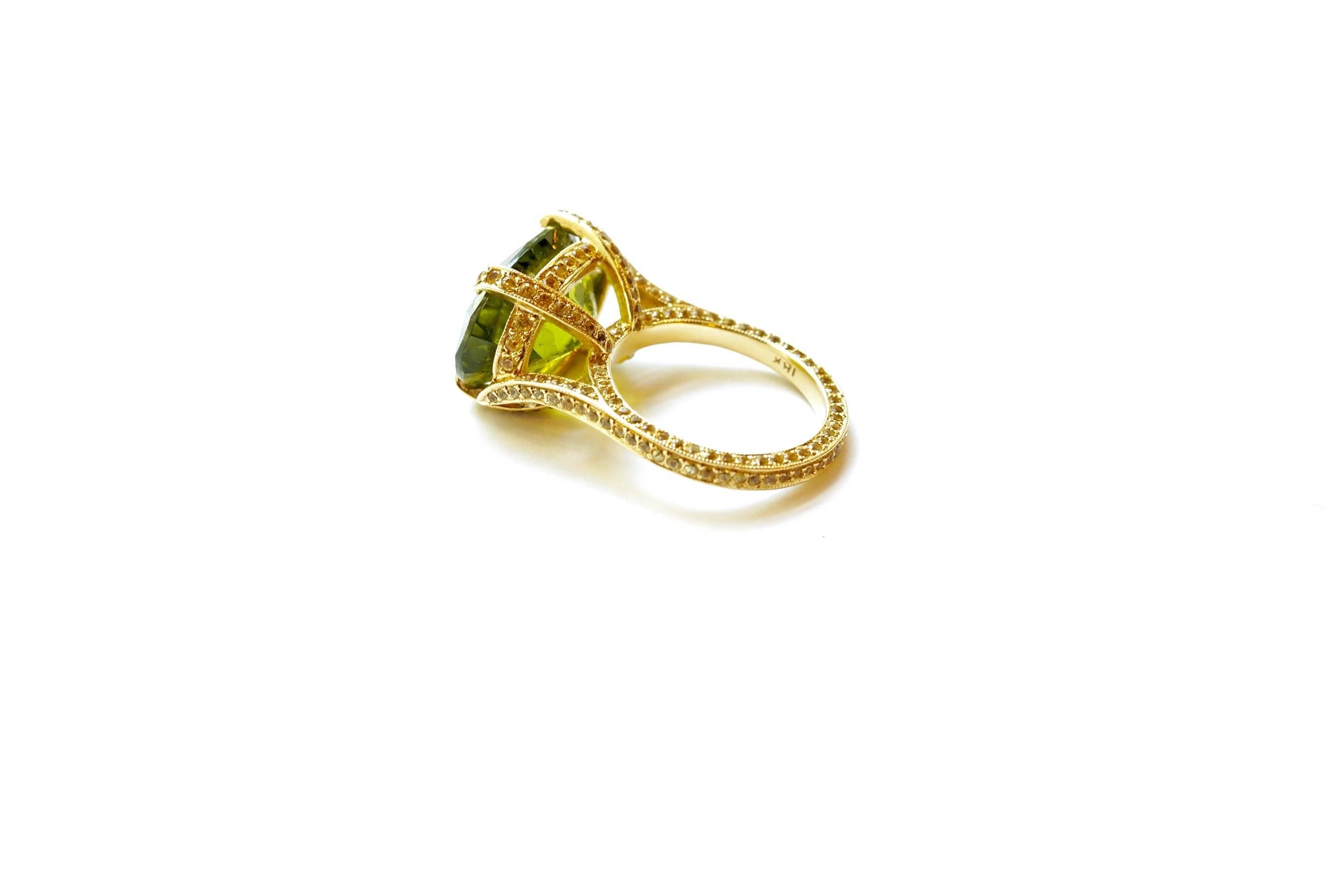 Peridot & Yellow Sapphire Big Ring
A faceted oval-shaped peridot ring set in eighteen-karat yellow gold, completely encrusted with yellow sapphires.
Size 6 ¼ - adjustable upon request (minimal charges may apply)
Peridot Total Weight – 12.20