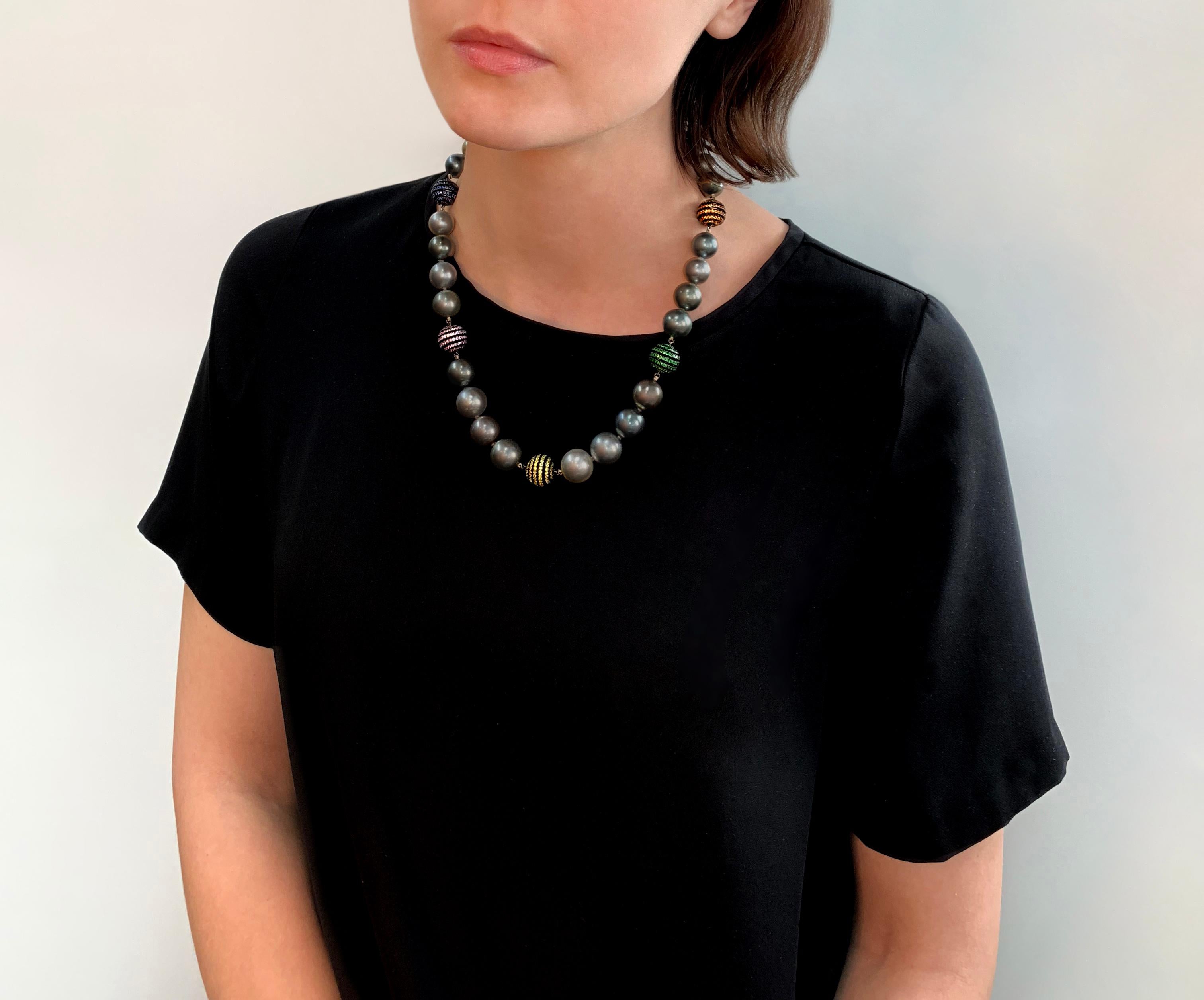 This hypnotic necklace by Yoko London features a spectacular combination of cool Tahitian pearls and multi-coloured Sapphires. The vibrant colours of the sapphires stand in perfect contrast to the silver hues of the Tahitian pearls, making for a