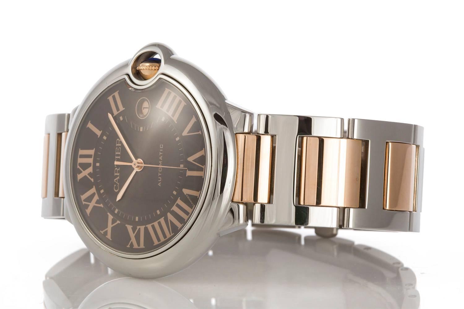 Authentic Cartier 18k Rose Gold & Steel Chocolate Ballon Bleu Automatic Watch. This watch features a 42mm case and beautiful chocolate roman dial. This watch will fit up to a 7.25