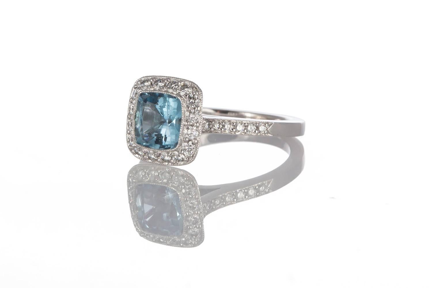 Guaranteed Authentic Tiffany & Co. Legacy Platinum Cushion Cut Aquamarine & Diamond Ring. This absolutely stunning ring features a Tiffany & Co's halo setting, fashioned from .950 Platinum, accented by diamonds and set with a Tiffany