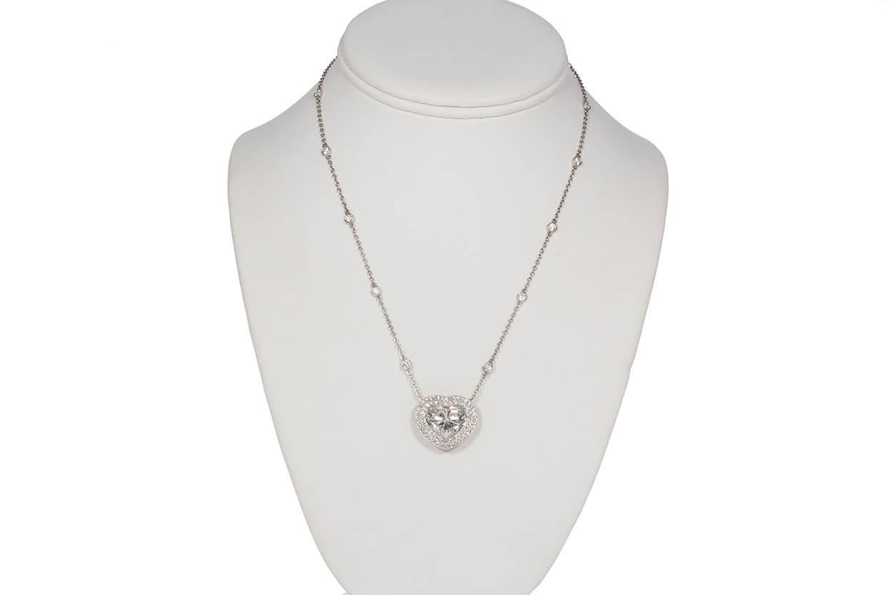 GIA Certified Platinum 18k Gold & Diamond Heart Pendant Necklace. This stunning necklace features a GIA Certified 7.02ct I/SI2 Heart Brilliant Cut Diamond set in Platinum and 18k Gold accented by an estimated 2.14ctw Round Brilliant Cut