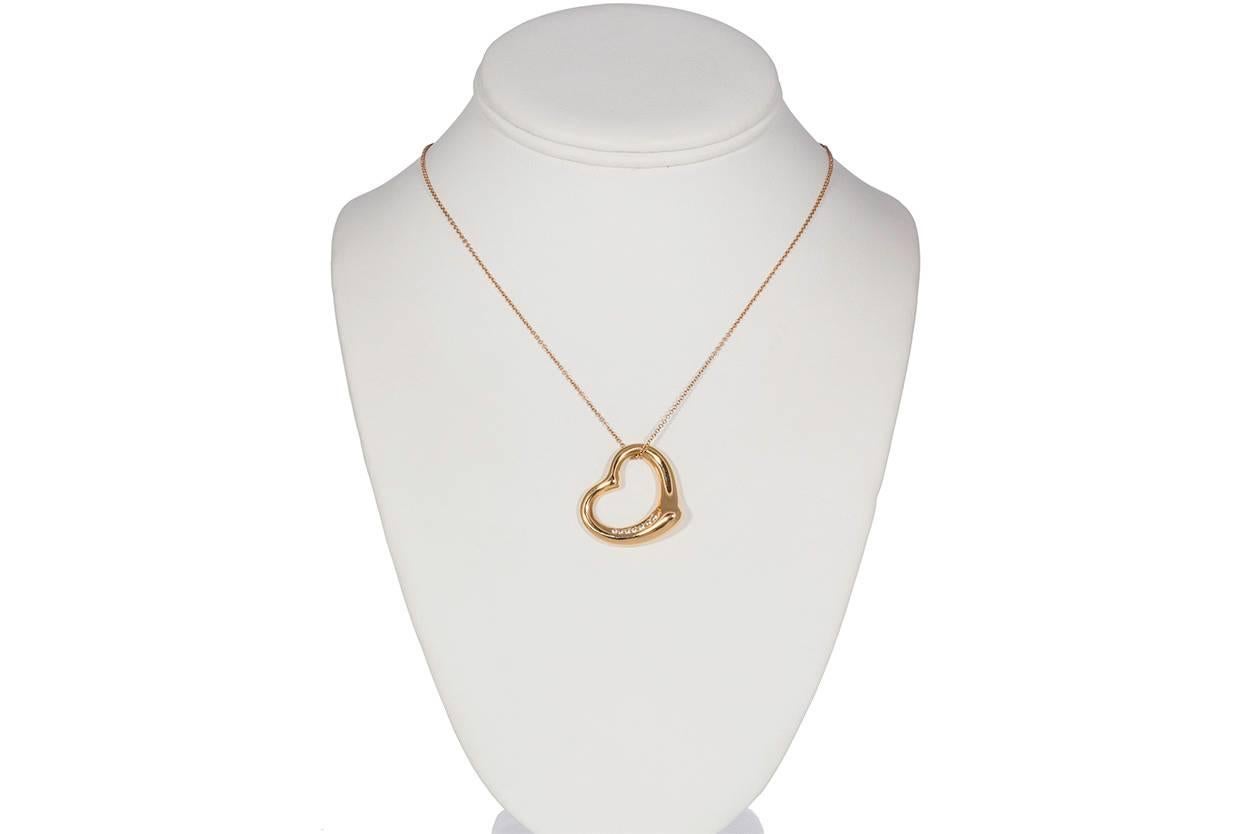 Tiffany & Co. Elsa Peretti 18k Rose Gold & Diamond Open Heart Pendant Necklace. This is Elsa Peretti's most celebrated iconic pendant with pavé diamonds in 18k gold. This piece is in very good condition and shows very few signs of wear. This