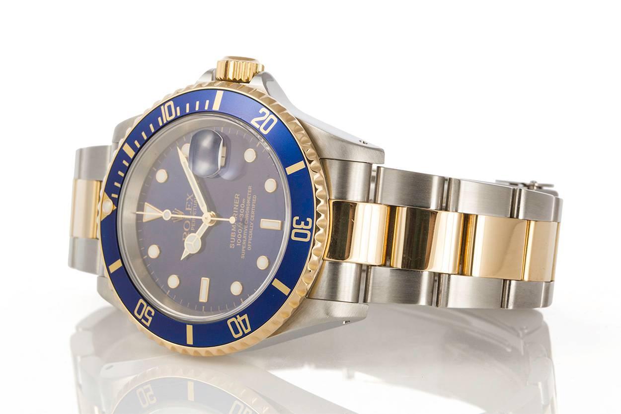 We are pleased to offer this 2000 Rolex Two Tone 18k Gold & Stainless Steel Submariner 16613. The Submariner will always be one of the most coveted Rolex watches and this ones a classic. This watch features a two tone design with a stunning blue