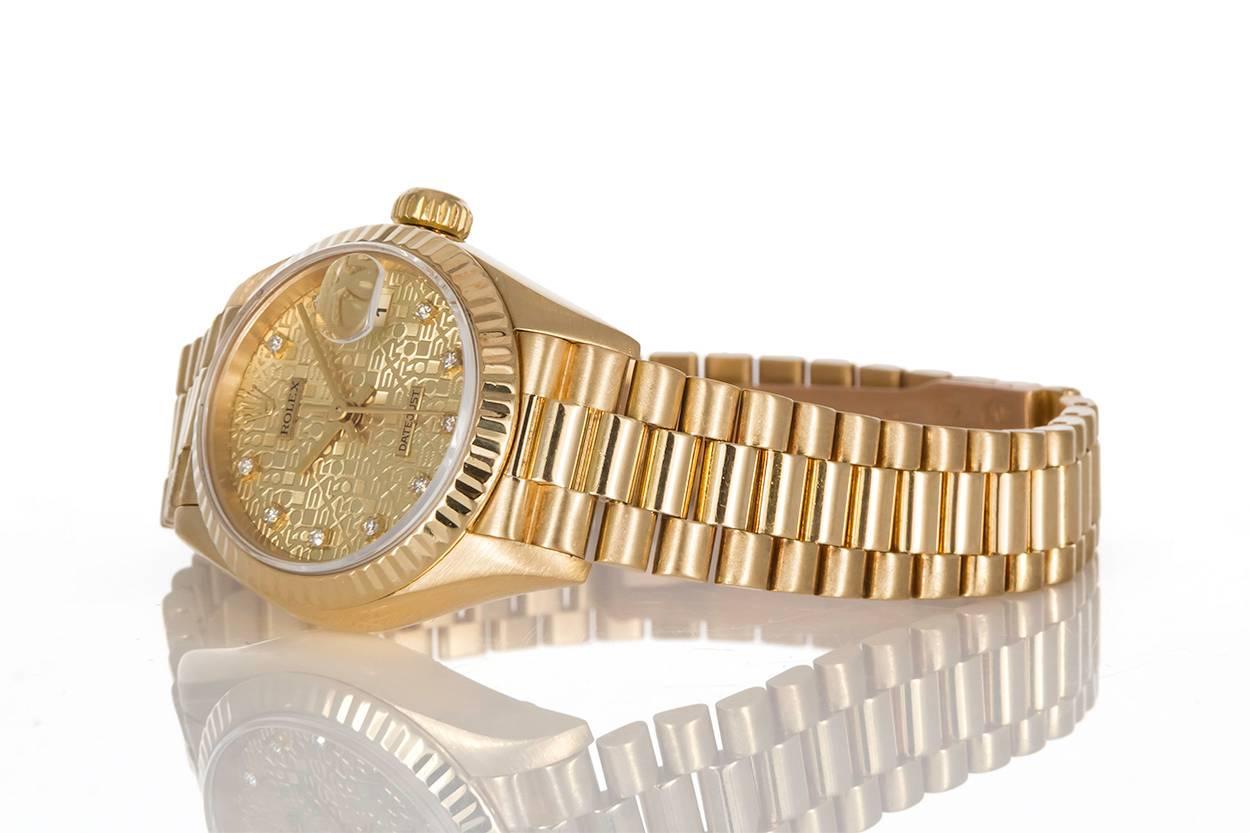 We are pleased to offer this 1997 Rolex Ladies Datejust President 79178. This is a classic 26mm ladies watch featuring an authentic Rolex factory champagne diamond jubilee dial. The watch comes complete with the original inner and outer boxes as