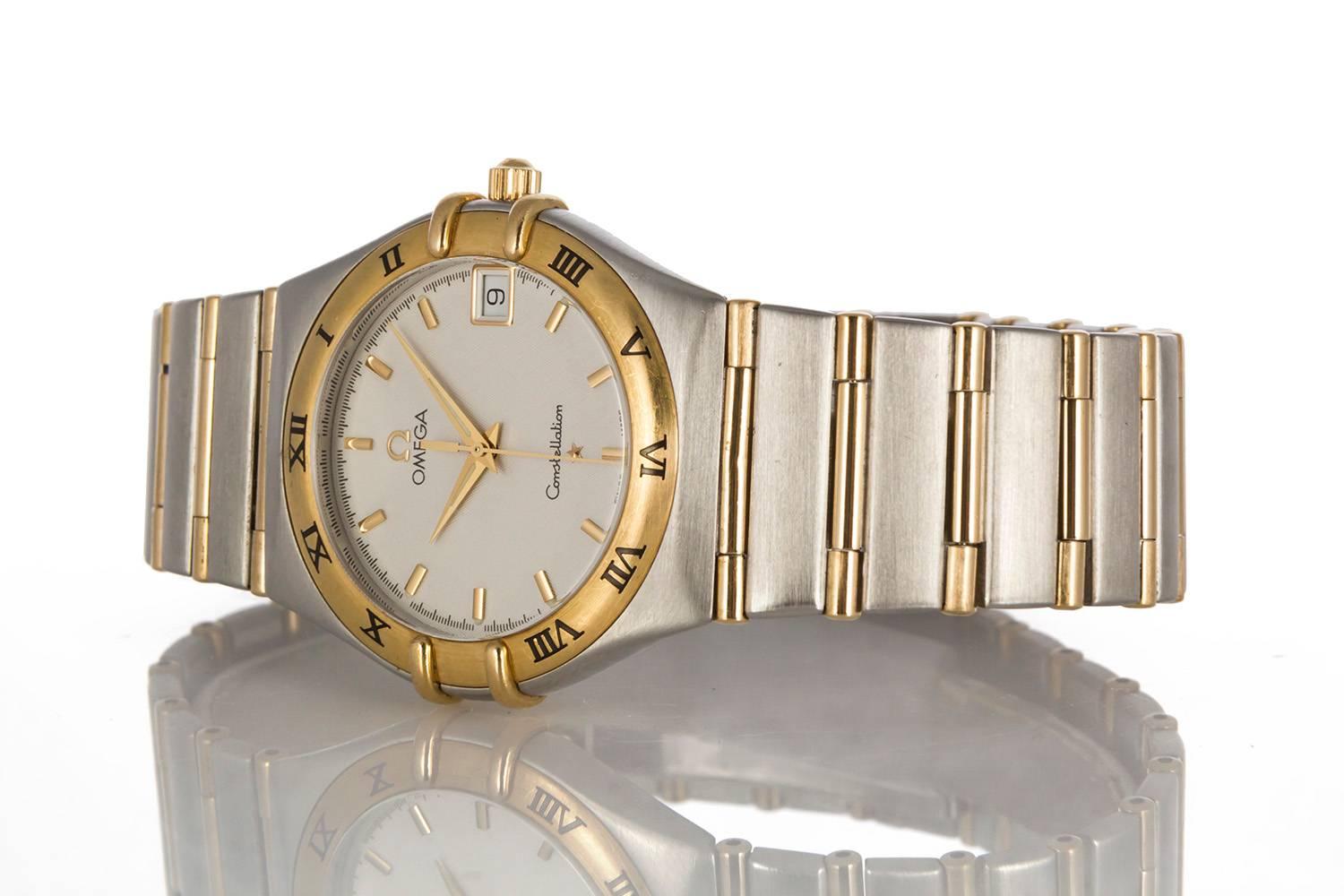We are pleased to offer this Omega Constellation Two Tone 18k Yellow Gold & Stainless Steel Mens Watch. It features a quartz movement set in a 34mm stainless steel & gold case. It will fit up to a 7.5