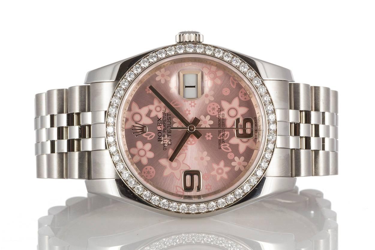 Ladies Rolex Stainless Steel Datejust 36mm 116244. This is a great larger ladies Rolex featuring a factory original diamond bezel and pink flower dial. It also features a scrambled serial number and engraved inner bezel along with the newer style