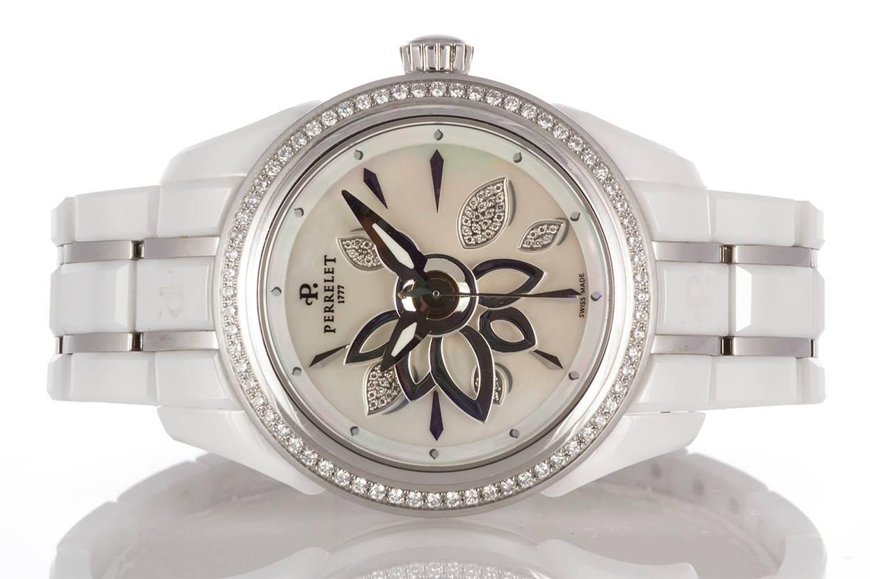 Perrelet Ladies White Ceramic Diamond Flower Automatic Watch. This is a very stylish larger ladies watch featuring a 40mm white ceramic case, diamond bezel & diamond flower mother of pearl dial. The watch will fit up to a 7" wrist. The